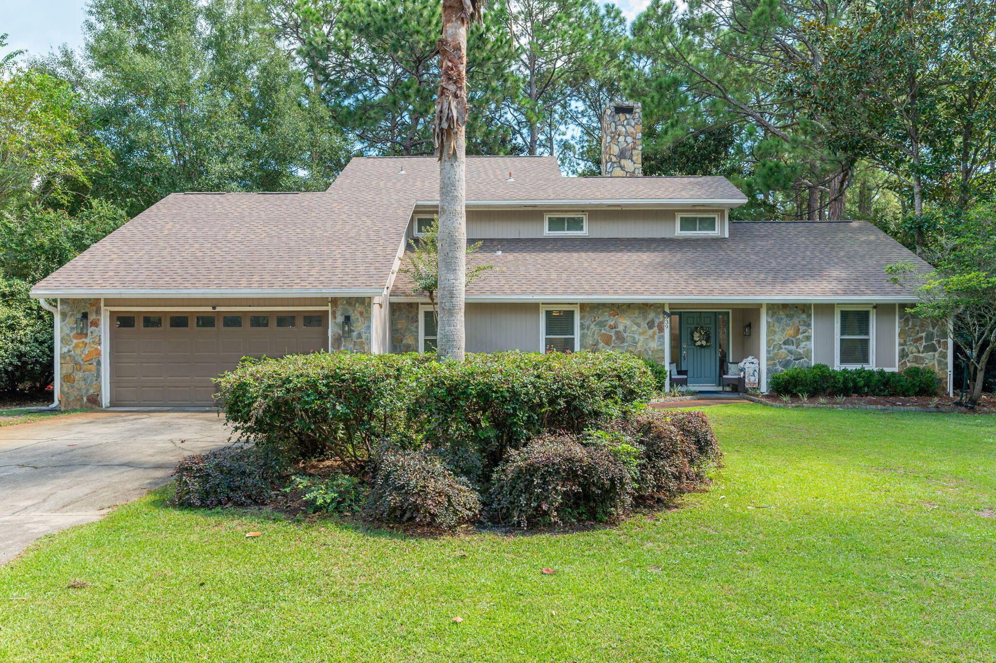 Welcome to 639 Birkdale Circle, located in the Bluewater Bay area of Niceville. Offering an impressive 2,830 square feet of living space, this 4-bedroom, 3-full-bath home combines generous room sizes, thoughtful updates, and multiple indoor and outdoor living spaces.

The interior features separate living and family rooms, providing plenty of flexibility for entertaining and everyday living. A dramatic oversized fireplace creates a striking focal point in the living room. The kitchen was completely updated in 2023 and features granite countertops, double ovens, a dedicated coffee bar, and plenty of space for meal preparation and gathering. All three bathrooms were also updated in 2023 with granite countertops, including one featuring a modern soaking tub. Additional improvements include updated lighting, removal of the popcorn ceilings, new tile flooring in the primary suite, and plumbing converted to PEX in 2021.

Outdoor living is another highlight of this property. A large screened porch extends the downstairs living space, while the primary suite enjoys access to its own second screened porch. The expansive backyard provides even more room to enjoy the outdoors and features a fire pit for evenings outside.

With 4 bedrooms, 3 full bathrooms, multiple living areas, two screened porches, extensive updates, and a Bluewater Bay location, 639 Birkdale Circle offers an exceptional combination of space, functionality, and updated finishes. No HOA.