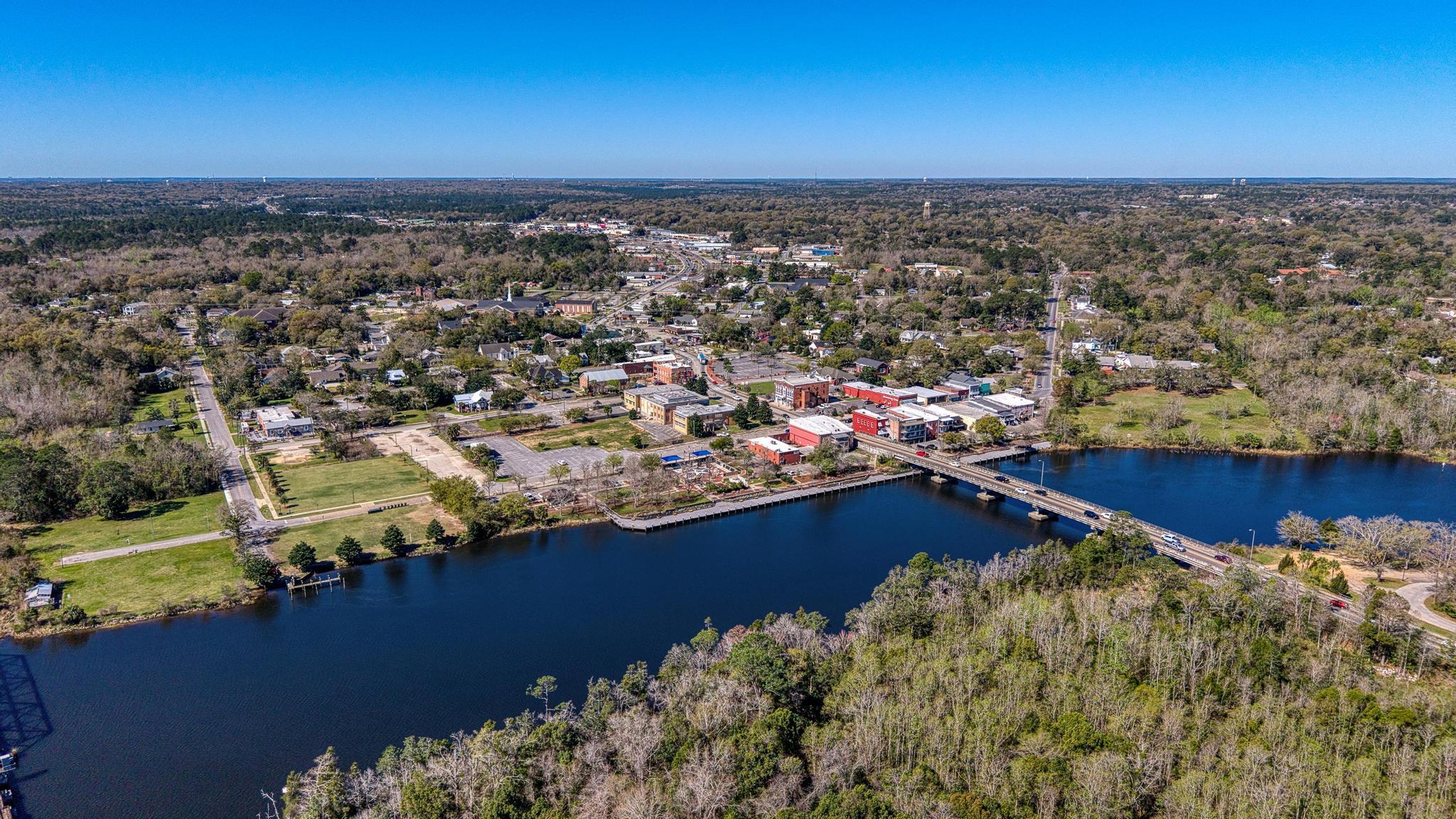 Rare waterfront opportunity offering 200 feet of deep-water frontage, ideal for boating, fishing, kayaking, and swimming--right from your backyard. This unique property features a licensed marina with 15 slips and significant potential for expansion, making it an excellent opportunity for investors or owner-operators looking to generate additional income.

With vision and a little TLC, the possibilities are wide open: expand the marina, add additional slips, or explore future waterfront business opportunities.

The 1,357-square-foot home provides comfortable living with flexibility for an owner, on-site manager, or potential rental income. The property also includes a 380 square foot enclosed patio and a 200 square foot workshop, adding functional space for storage, hobbies, or marina operations. Located just 3 minutes from Downtown Milton, 34 minutes to Downtown Pensacola, 44 minutes to Pensacola Beach, and 48 minutes to NAS Pensacola, this property offers a rare combination of waterfront lifestyle, business potential, and convenient access to the Gulf Coast. Enjoy the marina lifestyle while creating income and building something special on the water. Opportunities like this are hard to find in this area.