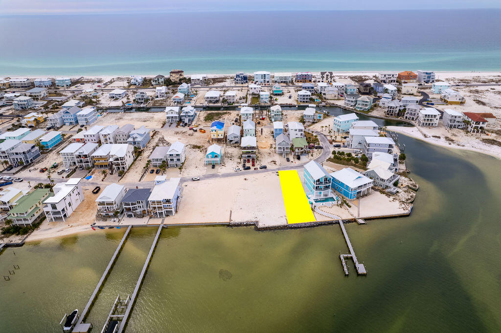 The west end is the best end; welcome to your future oasis on Navarre Beach. Lot 19 in Grand Navarre is a stunning waterfront gem that boasts 45ft of width and a staggering 143ft of depth directly on the Santa Rosa Sound featuring a brand new seawall. The property is angled for not only sunset views but unobstructed views of the National Seashore coastline; a rare treat. Just a stone's throw distance to the Gulf of Mexico and public beach access; this location is key for building your personal peaceful retreat, expanding your investment portfolio by building a renters dream destination, or becoming a full time resident of the tight knit community of Grand Navarre with NO HOA. This blank canvas with panoramic views allows for endless possibilities! Let's bring your vision to life. Ask about custom drawn plans for this premier property.