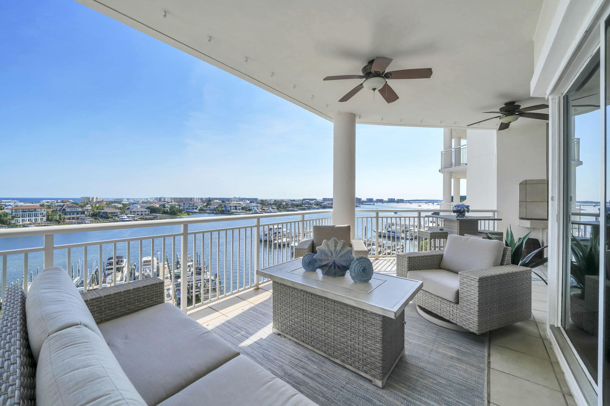 Some waterfront homes offer beautiful views. Few offer a lifestyle that begins the moment you step outside your door! Perfectly positioned above the sparkling waters of Destin Harbor, this exceptional four-bedroom waterfront residence in the prestigious, gated Grand Harbor community combines over 2,525 square feet of luxurious living with one of the property's most coveted features--a Private Deep-Water Boat Slip with a 16,000-pound Lift. From morning cruises through Destin Harbor to sunset dinners by boat & effortless access to the East Pass, the Gulf of Mexico, Choctawhatchee Bay, & world-famous Crab Island, this is a residence designed for those who truly embrace Life On The Water. Offering breathtaking panoramic views of both the Destin Harbor & the emerald waters of the Gulf of Mexico, this remarkable residence lives more like a private waterfront home than a traditional condominium. Expansive windows & sliding glass doors fill the home with natural light while showcasing spectacular water views from nearly every room. Thoughtfully designed for both everyday living & effortless entertaining, the open-concept floor plan features generous gathering spaces, abundant storage, and seamless indoor-outdoor living centered around an oversized covered balcony complete with a built-in gas grill. Whether enjoying your morning coffee as boats leave the harbor or unwinding with spectacular sunsets over the Gulf, every space has been designed to capture the beauty & tranquility (MORE) with spectacular sunsets over the Gulf, every space has been designed to capture the beauty & tranquility of its extraordinary setting.

The spacious living room features a gas fireplace and flows seamlessly into the dining area & well-sized chef's kitchen. Designed to impress, the kitchen offers a gas cooktop, double ovens, abundant custom wood cabinetry, a walk-in pantry, and an oversized breakfast bar with generous seating, making it equally suited for intimate family dinners or entertaining larger gatherings.

The luxurious primary suite is a private waterfront retreat, complete with a sitting area, breathtaking harbor views, direct balcony access, and a spa-inspired bathroom featuring dual vanities, a jetted soaking tub, a separate walk-in shower with dual shower heads, a private water closet, & an oversized walk-in closet.

Three additional guest bedrooms each feature private en suite bathrooms, ensuring exceptional comfort and privacy for family & guests. The fourth bedroom is currently utilized as a secondary living area, offering flexibility as a media room, executive office, hobby space, or additional sleeping quarters. A spacious laundry room provides additional storage, while the exterior storage room with power, conveniently located just outside the front door, offers ample space for beach gear, fishing equipment, water toys, or even an additional refrigerator.

Enhancing the value of this extraordinary residence is the highly sought-after Private Boat Slip accommodating up to a 32-foot vessel with a 16,000-pound lift. Boat slips are limited within Grand Harbor, making this an exceptional opportunity for boating enthusiasts seeking immediate access to some of the finest boating destinations along the Emerald Coast. Spend your days cruising to waterfront restaurants, exploring Crab Island, fishing the Gulf, or enjoying the pristine waters of Choctawhatchee Bay-- all just moments from your private dock.

Grand Harbor offers an owner-focused waterfront lifestyle with exceptional amenities, including a private marina, resort-style pool & spa overlooking the harbor, an expansive waterfront sun deck, outdoor gathering areas with elevated bar seating, a fitness center, covered garage parking, Tesla charging stations, abundant overflow parking, an owner's gathering room with a fireplace and large-screen television, a private board room, paddleboard & kayak launch, & a private community dog park. An exclusive overflow guest suite is available for visiting family & friends, allowing your guests to enjoy a comfortable stay while preserving the tranquility of your own residence.

Unlike many Destin condominiums, Grand Harbor was thoughtfully designed for owners who value privacy, security, and a true residential atmosphere. With long-term rentals only, residents enjoy a quieter waterfront lifestyle without the constant turnover of weekly vacation guests, creating a community that feels more like an exclusive waterfront neighborhood than a resort. It is an ideal setting for a primary residence, an elegant second home, or a retirement retreat for buyers seeking an exceptional Coastal Lifestyle.

This is not simply another luxury condominium competing with every waterfront property in Destin. It is one of the area's rare opportunities to own a private, owner-focused waterfront residence that includes a coveted deep-water boat slip, immediate Gulf access, panoramic harbor and Gulf views, & the peace of a true residential community.

Whether you're relocating or simply searching for your forever home along the Emerald Coast, this exceptional residence offers a lifestyle that is increasingly difficult to find. Combining luxury, privacy, world-class boating access, and the unmatched Grand Harbor lifestyle, this remarkable waterfront home represents one of Destin's most exclusive offerings. Schedule your private showing or virtual tour today & experience waterfront living at its finest!