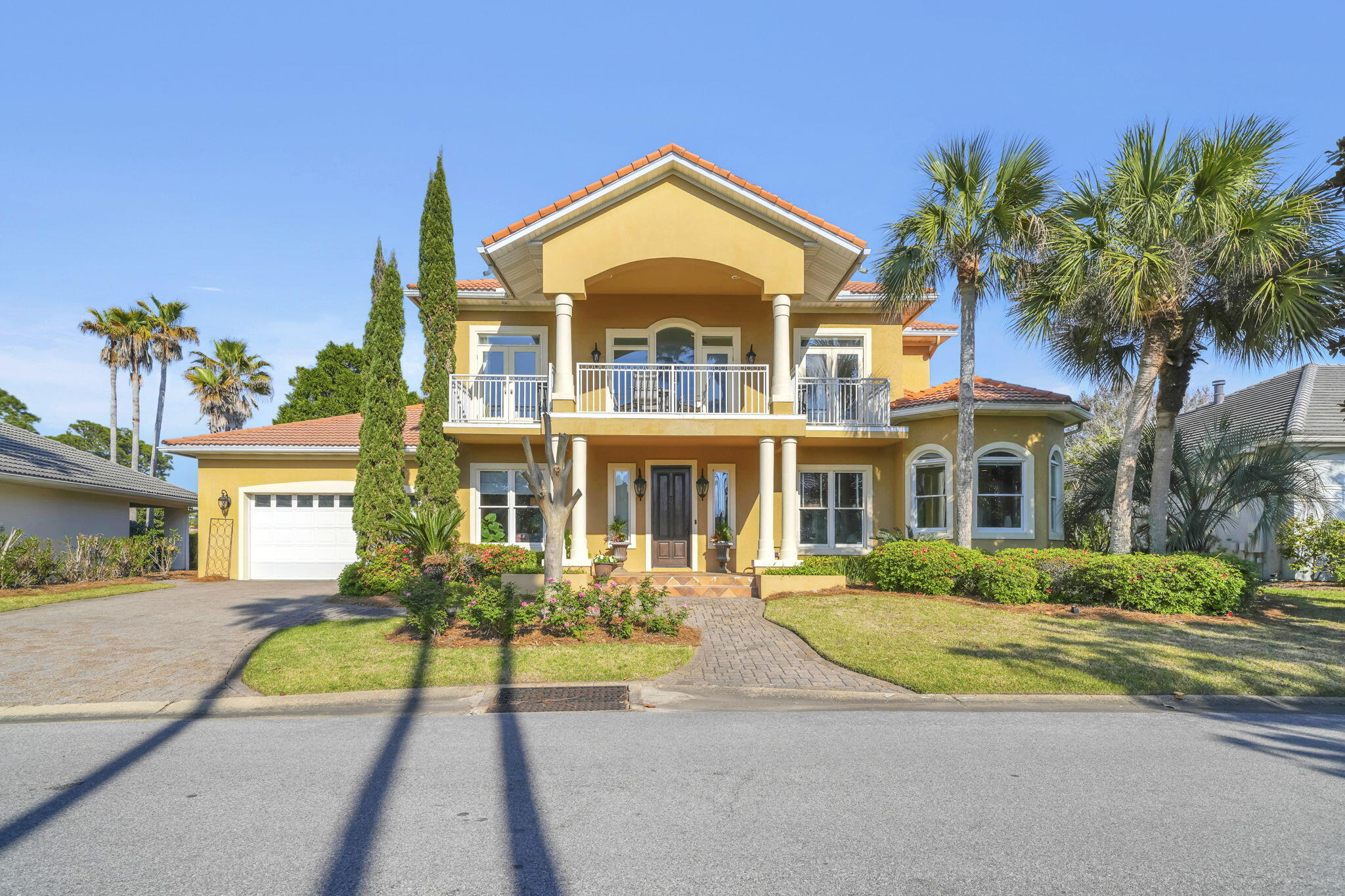 Luxury Mediterranean-style rental in the gated Sunset Beach community of Bluewater Bay offering bay, lake, and golf course views. Built with solid concrete and stucco construction, this elegant home features soaring cathedral ceilings, walnut stairs, wrought iron railings, custom built-ins, gas fireplace, and abundant natural light. The gourmet kitchen includes Taj Mahal countertops, stainless appliances, ice maker, oversized pantry, breakfast bar, and dining area overlooking the water. Spacious primary suite with updated spa-style bath, custom closet, and sitting area. Upstairs offers 3 additional bedrooms, updated baths, bonus living space, and balcony access with bay views. Private office, screened porch, open lakeside patio, and access to the Sunset Beach pool and clubhouse complete this exceptional coastal rental.
