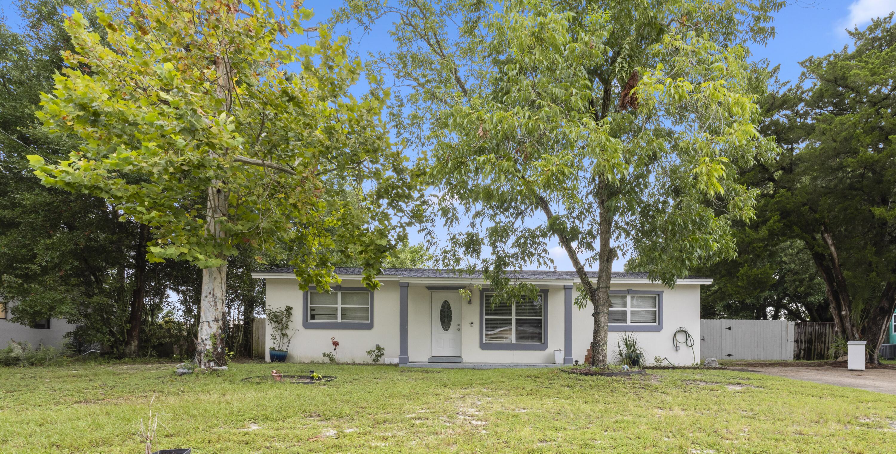 MOTIVATED SELLER! This an adorable 4-bedroom 2-bath home is waiting for you! Porcelain tile throughout. Updated cabinets in the kitchen. Updated bathrooms. Track lighting! Seller upgraded the A/C ventilation system for $20,000. Extended patio. Upgraded fence for $5,000. Healthy Pear tree, Peach and Apple tree. Vacant chicken coop. Seller open to buyer credits with the right offer. Great Location!
Inside has recently been painted all white in the living room and kitchen.