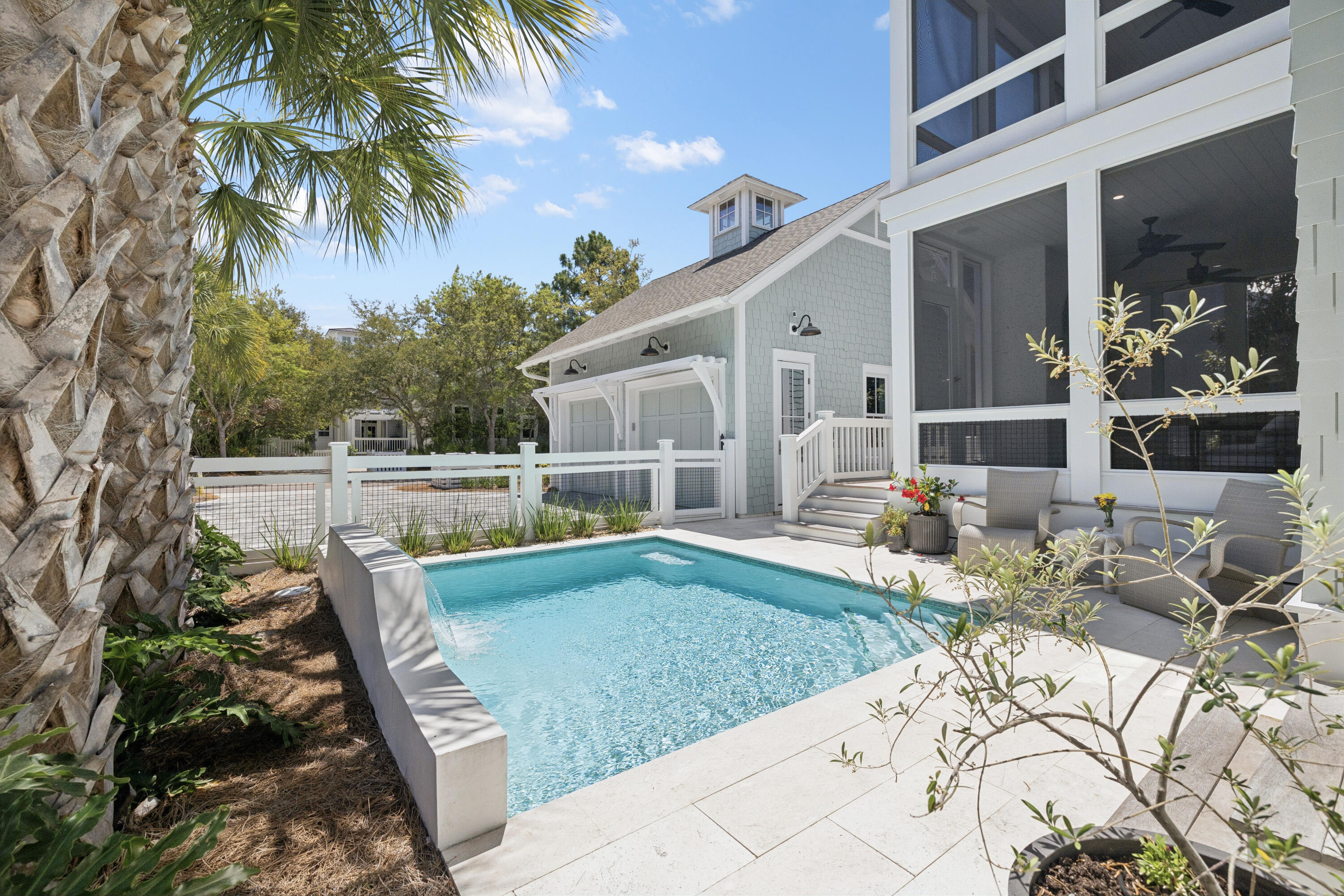 A quiet sense of refinement reveals itself from the moment you arrive, set behind the private gates in the Main Gate of Watersound Beach, where thoughtful architecture and seamless indoor-outdoor living define a home designed for both retreat and gathering. Built in 2022 and meticulously maintained by its original owner, this residence spans over 3000 square feet of carefully considered living space by Allison Ramsey Architects, where every detail feels purposeful and enduring. A welcoming front porch sets the tone, leading into a grand living area anchored by a well-equipped kitchen designed with connection in mind. White oak hardwood flooring, tongue-and-groove walls, and substantial cedar beams lend warmth and character, while a gas fireplace framed in white brick creates a natural focal point. The kitchen is equipped with a Sub-Zero refrigerator, double ovens, six-burner cooktop, wine cooler, and a generous walk-in pantry, offering both beauty and function.

Just beyond, more than 850 square feet of porch space extends the living experience outward, creating a seamless transition between interior comfort and the coastal air. A screened porch with a second gas fireplace and vented grill invites relaxed evenings and effortless outdoor dining, while the private pool offers a refreshing escape after a day at the beach, complemented by a convenient pool bath and adjacent powder room.

The first level also includes a well-appointed guest suite with an ensuite bath, a mudroom-style laundry space with brick flooring, and thoughtful access points designed for everyday ease. Upstairs, the primary suite serves as a private retreat with its own porch, dual closets, and a spa-like bath featuring double vanities, a soaking tub, custom tiled walk-in shower, and a separate water closet. A second primary suite on this level provides flexibility and privacy, while an additional ensuite bedroom, including a bunk room with handcrafted detail, ensures comfortable accommodations for guests. A second laundry area serves the upper level, enhancing the home's livability. Every bedroom enjoys a private bath, creating a true sense of comfort and autonomy throughout.

Positioned on a homesite bordered by lush vegetation, the property enjoys direct access to a network of winding boardwalks that lead through preserved natural landscapes and onward to the turquoise-hued water. The setting is both peaceful and connected, offering proximity to multiple beach accesses, parks, fitness facilities, and gathering spaces, all within a thoughtfully designed coastal environment.

Offered furnished with select exclusions and impeccably maintained, the home also features a two-car garage and generous driveway parking. With more than a mile of private white sand shoreline, miles of scenic boardwalks, and golf cart paths leading to the beach, this is a setting defined by space, privacy, and a distinctly natural coastal experience -- all just moments from the dining and lifestyle offerings along 30A.