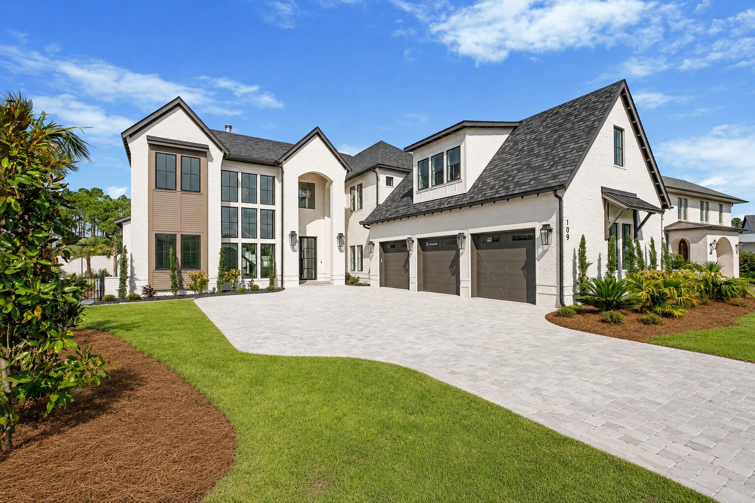 109 Norman Court is a statement of sophistication and scale within the gates of Watersound Camp Creek. Spanning 6,700 square feet, this six-bedroom, seven-bathroom estate accentuates refined elegance and everyday comfort. Stepping into the home, you're met with a dramatic sense of arrival as the foyer showcases a striking floating staircase beneath soaring 24-foot ceilings. The expansive great room, anchored by a custom marble mantle with venetian plaster accent and gas cannonball fireplace, offers a welcoming space for both relaxation and entertaining, flowing seamlessly into the chef's kitchen. Here, an oversized island pairs with professional-grade appliances, including a gas range with custom hood, while a scullery provides a prep sink and wine refrigerator. Floor-to-ceiling sliders in the great room and dining area blur the boundary between indoors and out, inviting in natural light and opening directly to the covered lanai. A fully equipped summer kitchen invites warm-weather gatherings, while the outdoor hearth creates a cozy retreat in cooler months. Beyond, the backyard features a private pool and spa with a soothing water feature, a dedicated seating area, and a fire pit an inviting haven for year-round enjoyment.

The first-floor primary suite is a private retreat, offering a grand walk-in closet, a spa-caliber bath with an oversized soaking tub, and sliding glass doors that frame serene views of the pool. 

Upstairs, four spacious guest suites offer privacy and comfort, each with its own bath. Throughout the home, every bedroom is finished with tray ceilings for a subtle architectural touch that underscores the attention to detail. A flexible bonus space above the three-car garage provides endless potential for a media room, private gym, or home office.

Set toward the front of the neighborhood where construction is nearly complete, the property enjoys both a peaceful pond backdrop and convenient access to world-class amenities. Watersound Club membership is included, granting access to three premier golf courses, the Gulf-front Beach Club with over a mile of private shoreline, resort-style pools and lazy river, a state-of-the-art wellness center, tennis and pickleball courts, and acclaimed dining venues.

109 Norman Court is a rare opportunity to experience the very best of 30A living in one of its most exclusive private communities