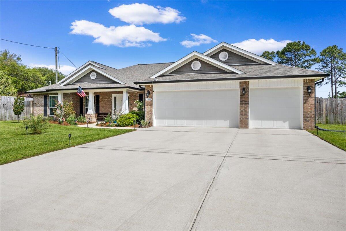 Move in Ready & Professionally cleaned! This one doesn't just check the boxes; it's designed to stand out in today's market with the features buyers are actively searching for in Navarre, Florida real estate.

Welcome to this beautifully upgraded 4-bedroom, 3-bath home with a 3-car garage in the heart of the Florida Panhandle--offering a highly desirable split floor plan, modern finishes, and indoor-outdoor living that defines the Navarre lifestyle near the Gulf Coast.

From the moment you step inside, you're greeted by a versatile flex space--ideal for a home office, remote work setup, or formal living room--plus a dedicated dining area perfect for hosting. The interior has been painted in a coastal, beach-inspired color palette, creating a light, airy feel buyers love in Florida homes for sale.

The open-concept layout is exactly what today's buyers are searching for, with the kitchen overlooking the family room-perfect for entertaining and everyday living. This upgraded kitchen features:

Granite countertops
Stainless steel appliances
Glass tile backsplash
Large center island with new designer light/fan fixture
Pots-and-pans drawers for easy organization
Recessed and pendant lighting
Oversized walk-in pantry

The primary suite offers a true retreat with private access to the covered lanai, ideal for morning coffee or evening relaxation. The spa-like ensuite includes a zero-entry walk-in tile shower, soaking tub with custom tile surround, and a spacious layout designed for comfort.

Three additional bedrooms all feature walk-in closets and ceiling fans, while one bathroom functions as a cabana bath with exterior access--a must-have for buyers considering a future pool or outdoor entertaining space.

Step outside to your fully fenced, cleared, and irrigated backyard, complete with fruit trees and room to create your dream outdoor oasis. There's even a chicken coop for those wanting a touch of homesteading-- fresh eggs right in your own backyard!

Additional high-value features include:

*3-car garage (ideal for storage, golf cart, or workshop space)
*Fabric hurricane shields for storm protection,
*Energy-efficient construction package (lower utility costs)
*Blinds installed on all functional windows
*Transferable Maverick STRUCTURAL warranty for buyer peace of mind
* Located in sought-after Navarre, FL, this home offers easy access to Navarre Beach, Hurlburt Field, Eglin AFB, and top-rated schools, making it ideal for military relocation, primary residence buyers, and investors alike.

If you've been searching for a move-in-ready home in Navarre with upgrades, space, and outdoor living, this one delivers. Schedule your private showing today and experience why so many buyers are choosing to call Navarre home.