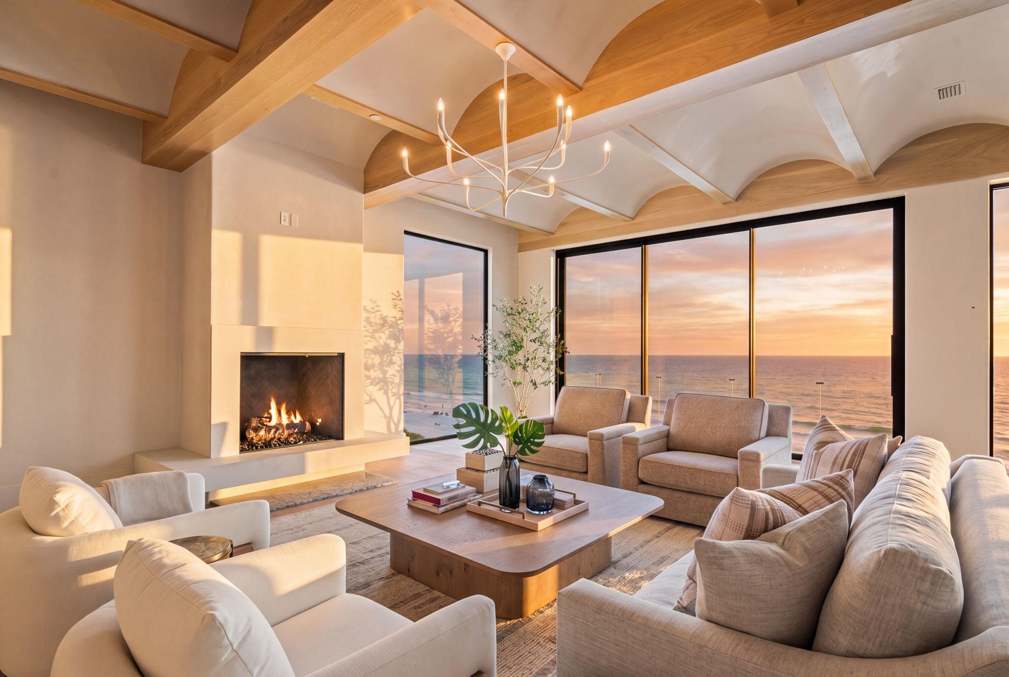 Rising directly from the sand at the coveted east end of 30A, this brand-new Gulf-front estate redefines beachfront living in Inlet Beach. Completed in 2026, designed by Stackable Mracek Design Group and built by Corestruction, the residence spans four light-filled levels and approximately 11,188 square feet, all served by a private elevator. Walls of glass frame the emerald water from nearly every room, while 65 feet of private Gulf frontage place the beach just steps from the door.

Built to endure as beautifully as it impresses, the home features solid stucco-over-block construction on a piling foundation, engineered for coastal living. Inside, the craftsmanship is immediately apparent, with wide-plank white oak floors, honed marble, beamed and coffered ceilings, soaring walls of windows, and designer brass throughout. The main living level centers on a gourmet kitchen with an oversized island, dual refrigeration, and a butler's pantry, complemented by a dedicated wine room and wet bar. From there, the great room flows beneath twelve-foot ceilings onto an expansive Gulf-front covered porch that captures both the breeze and the view.

With 7 bedrooms and 7.5 baths, there is room for the whole family and then some. Five en-suite bedrooms and a custom built-in bunk room ensure everyone has a place to land, while the entertainment offerings rival a private resort. A media and movie room, multiple game rooms, and a dedicated fitness room with sauna and steam cover every age and interest. An indoor-outdoor pool house blurs the line between living space and beachfront leisure, opening directly to the pool deck.

The entire top floor is devoted to a private owner's retreat. Vaulted tongue-and-groove wood ceilings crown a serene bedroom, a sitting room, and a spa-inspired bath with a freestanding soaking tub and dual vanities. A custom dressing room provides generous storage, and a Gulf-front balcony offers a front-row seat to sunset after sunset over the water.

Outdoor living is equally exceptional. A heated gunite pool with a sun shelf and spa anchors the deck, accented by water and fire features, a summer kitchen, and shaded lounging areas framed by lush, professionally lighted landscaping. Behind a private gate, a six-car garage with car lifts and a grand motor court deliver rare parking and storage for a beachfront property of this caliber.

Most remarkable of all is the opportunity that comes with the land. The estate is offered as a double lot, conveying two parcels together, which provides something almost unheard of on 30A, namely room to build. As illustrated in the accompanying renderings, the additional parcel can become the heart of a true private compound, with space for a regulation pickleball court, an expanded resort-style pool, and even a second residence of approximately 8,000 square feet. Whether the vision is a multi-generational family retreat, an entertainer's paradise, or an income-generating estate, the canvas is yours to complete.

Gated, elevator-served, and approved for short-term rental, this is both a turn-key income producer and a generational beachfront legacy. Ultimately, the chance to own this much of the Gulf, with the freedom and space to make it your own, simply does not come along on 30A.