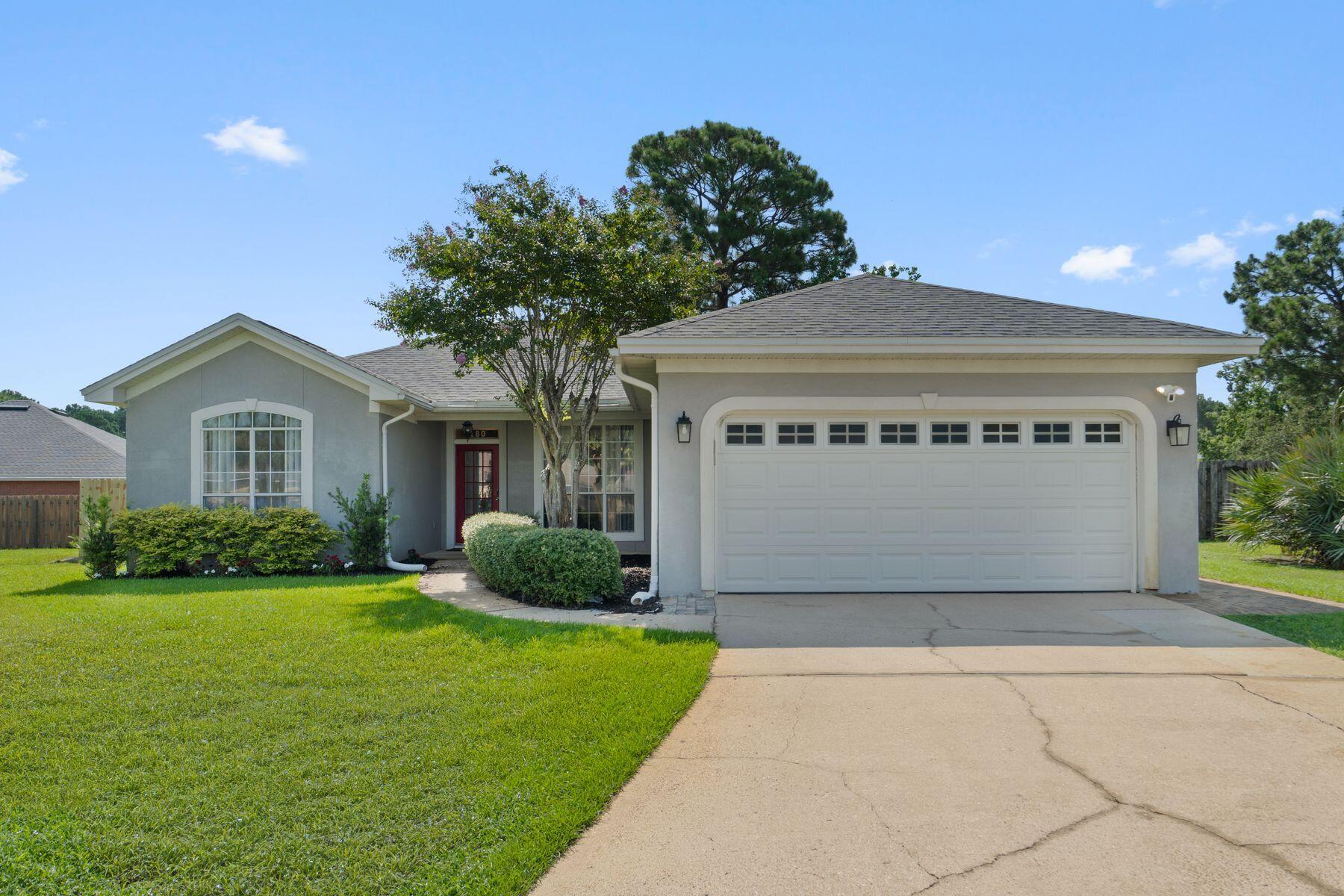 Set on one of the largest homesites in the neighborhood, this beautifully maintained single-level residence offers exceptional privacy, thoughtful updates and an ideal location just minutes from the bay and the Emerald Coast's renowned beaches. Positioned at the end of a quiet cul-de-sac, the home combines spacious indoor living with an expansive fenced backyard, creating an inviting setting for everyday living and effortless entertaining.

Vaulted ceilings elevate the open-concept living area, where a gas fireplace serves as a warm focal point. French doors on either side open into a heated and cooled Florida room with new windows installed in 2019, providing a versatile space to enjoy throughout every season. The adjoining dining room flows naturally into the spacious kitchen, featuring a large center island, hard-surface countertops, an undermount sink, stainless steel appliances, tile backsplash, pantry and abundant cabinet storage.

Designed with a desirable split-bedroom floor plan, the primary suite enjoys privacy on one side of the home, while two guest bedrooms, a full bath and the laundry room occupy the opposite wing. Matching luxury vinyl plank flooring extends throughout the residence, complemented by generous closet space and tub-shower combinations in both bathrooms. The guest bath has been refreshed with a new vanity, while the attached two-car garage offers additional attic storage. The approximately quarter-acre homesite is among the largest in the community, offering a spacious fenced backyard, mature privacy, an expansive driveway, covered front porch and fresh landscaping. Recent improvements include a new HVAC system installed in May 2026, a new roof in 2020, a hurricane-rated garage door installed in 2019, a 2018 water heater and an active termite bond for added peace of mind. Furnishings, along with the washer and dryer, are negotiable.

Residents enjoy an exceptional collection of community amenities including a bayfront dock, swimming pool, tennis courts, park and pavilion. Just outside the neighborhood, a nearby bayfront county park offers a public boat launch, pickleball courts and a playground for even more outdoor recreation. Conveniently located near Sandestin Golf & Beach Resort, Silver Sands Premium Outlets, Destin Commons, dining, entertainment and the sugar-white beaches of the Emerald Coast, this home offers an easy, low-maintenance coastal lifestyle in a peaceful setting.