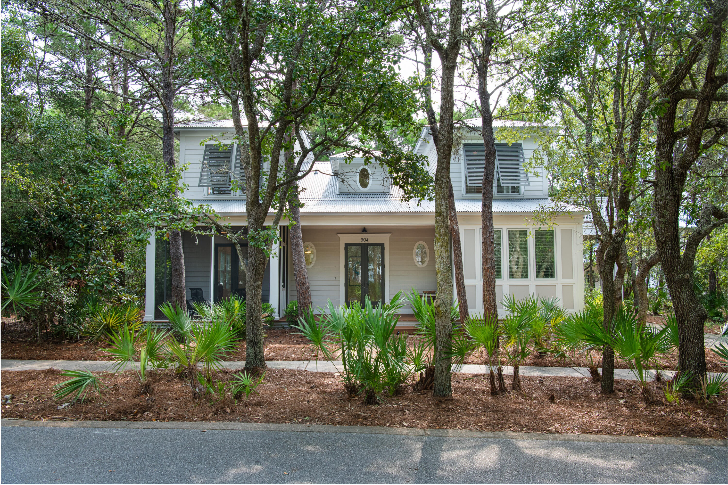 Discover this charming cottage in the exclusive Lake Place at Grayton Beach neighborhood south of 30A, a quiet gated community with no short term rentals. This updated home is a short distance to the beach, boutique shops & great restaurants. The neighborhood pool & park are just steps away including the community dock on Western Lake. Inside, the open living area flows easily onto a screened porch, perfect for morning coffee or evening entertaining. The separate dining room is ideal for meals with family and friends. The main floor features the primary bedroom, while the upstairs offers two additional bedrooms, each with its own full bath. This turn-key home is sold fully furnished and includes fresh updates: new roof in 2023, renovated kitchen, and newly painted walls & trim throughout. With no short-term rentals, Lake Place creates a peaceful neighborhood of homeowners who enjoy the serenity. The 20-acre community borders Grayton state park & the rare coastal dune lake leading to the Gulf. Kayak, bike the 30A trails, and experience the best of South Walton living. Whether you're looking for a primary home or a family getaway, this beach home offers comfort, nature, and a true 30A lifestyle. Schedule your showing today!