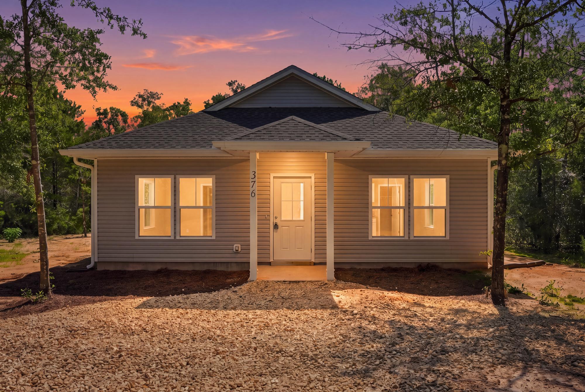 100% FINANCING ELIGIBLE! Experience the perfect blend of peaceful country living and everyday convenience in this brand-new 3-bedroom, 2-bath home on W. Michelangelo Road in DeFuniak Springs, Florida. Situated on a spacious, private homesite, this property offers plenty of room to add a pool, create your dream outdoor entertaining space, or simply enjoy the privacy and tranquility of your backyard.

Inside, you'll find a thoughtfully designed open floor plan featuring beautiful luxury vinyl plank flooring throughout the main living areas and elegant quartz countertops that add a modern touch to the kitchen and bathrooms. The bright, open layout is perfect for both everyday living and entertaining.

Located just minutes from shopping, dining, schools, and downtown DeFuniak Springs, you'll enjoy the best of both worlds--quiet country surroundings with town conveniences nearby. Plus, you're only about 30 minutes from the sugar-white beaches and emerald waters of Florida's Gulf Coast.

Enjoy peace of mind with a full builder's warranty and the freedom of no HOA fees or restrictions. Whether you're looking for your first home, a retirement retreat, or an investment, this new construction home offers quality, comfort, and an unbeatable location.