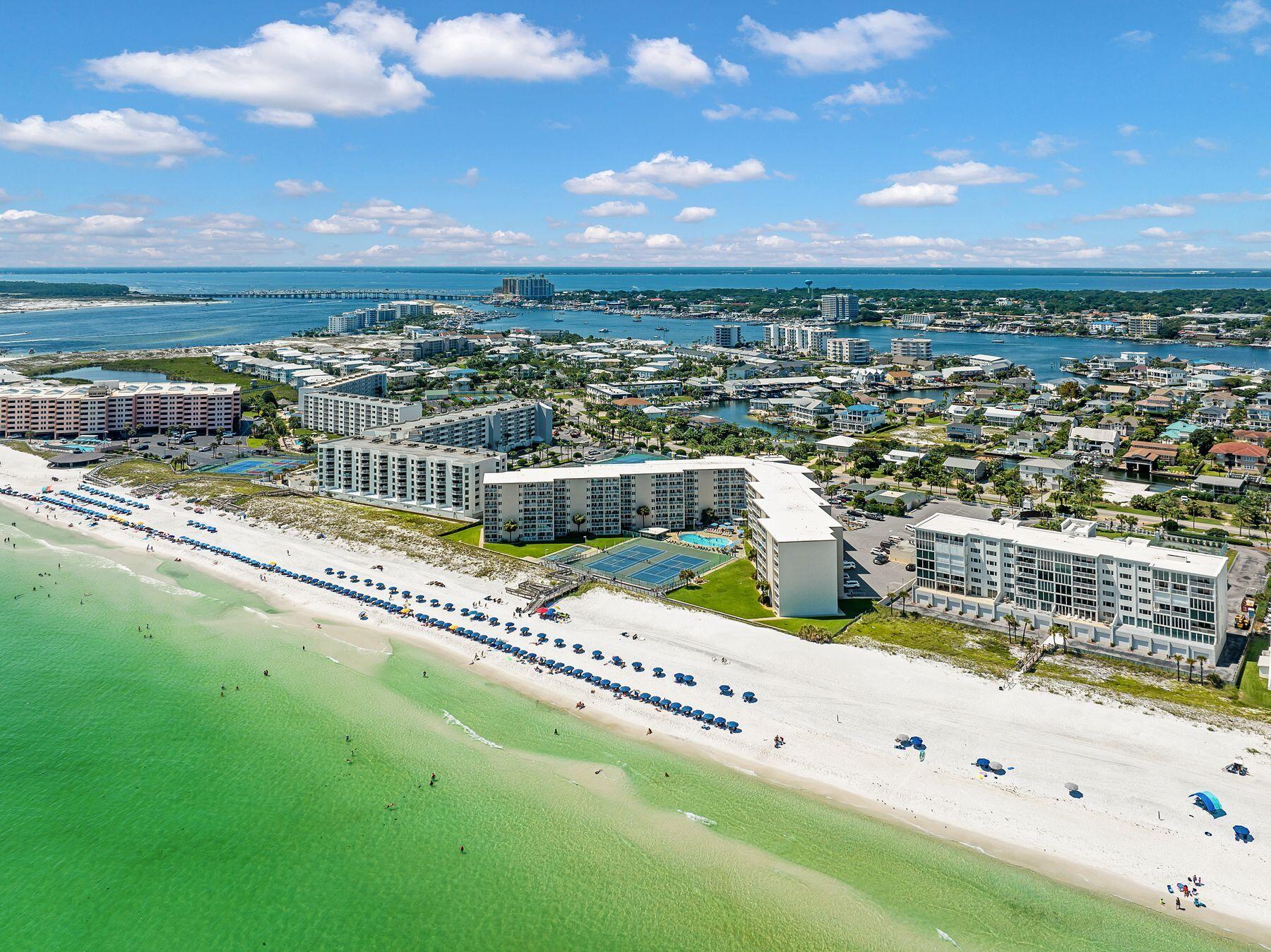 Capitalize on the strong demand for Destin vacation rentals with this beautifully updated condo at Holiday Surf & Racquet Club on sought-after Holiday Isle. Unit 307 offers the perfect combination of location, comfort, and resort-style amenities that attract repeat vacation guests year after year.

Designed to accommodate up to six guests, this inviting coastal retreat features low-maintenance LVP flooring throughout, an updated kitchen with granite countertops and stainless steel appliances, and an open-concept living and dining area that flows seamlessly onto a private Gulf-view balcony. The spacious primary suite includes a king-size bed, private balcony access, and an updated en-suite bath with a walk-in shower. A comfortable guest bedroom with a queen bed and an additional full bath provide ideal accommodations for families and groups.

The private balcony is a standout feature, offering sweeping Gulf views that create the unforgettable beach experience travelers seek. From morning coffee overlooking the water to spectacular sunset views, this outdoor living space is a major draw for vacation renters.

Holiday Surf & Racquet Club is a well-established beachfront resort offering an impressive lineup of amenities that enhance rental desirability, including direct beach access, a heated swimming pool, lighted tennis courts, shuffleboard, fitness rooms, saunas, BBQ grilling areas, and convenient on-site laundry facilities. Whether you're looking to expand your investment portfolio or own a vacation home that generates income when you're away, this turnkey Gulf-front condo offers an exceptional opportunity in one of Destin's most desirable beachfront communities.