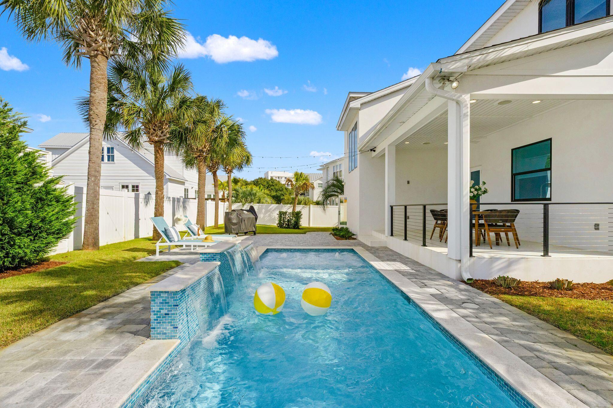 Tucked within the gated, non-rental community of Sand Cliffs, this thoughtfully designed residence offers privacy, space, and effortless access to the very best of the East end of 30A. Positioned on a large lot in a quiet cul-de-sac and just moments from the beach access, this is coastal living without compromise.
Spanning 3,378 square feet, the home features 4 bedrooms, 3 full baths, and 2 half baths with a floor plan that lives comfortably for both everyday life and entertaining. The first level flows seamlessly from the kitchen to dining, living, sitting area, and office, creating distinct spaces without sacrificing openness. The oversized kitchen island anchors the home, complemented by a JennAir appliance suite, wine refrigeration, and a Scotsman pellet ice maker -- equal parts functional and refined.
Upstairs, the primary suite offers a generous sitting area and a true retreat feel. A secondary suite provides flexibility for guests, while two additional bedrooms share a well-appointed Jack and Jill bath. A centrally located laundry room adds convenience where it matters.
Outside, the private pool is surrounded by green space rarely found this close to the Gulf, and pavered patio ready for your summer kitchen - offering room to gather, relax, and enjoy long afternoons at home. A separate cabana room adds versatility that is ideal for overflow guests, a pool lounge, or a creative escape. The elevator services both levels, and the one-and-a-half-car garage provides space for your golf cart, bikes, and beach gear.
Sand Cliffs remains one of the few truly private enclaves south of 30A -- gated, non-rental, and intentionally low density. From here, bike to Camp Creek Amenity Center, Alys Beach, and Rosemary Beach, or take your golf cart to Publix and Watersound Town Center. Everything you want is within reach, yet once inside the gates, it feels worlds away.
A rare opportunity for those seeking space, privacy, and proximity -- without the turnover of a rental-driven neighborhood.