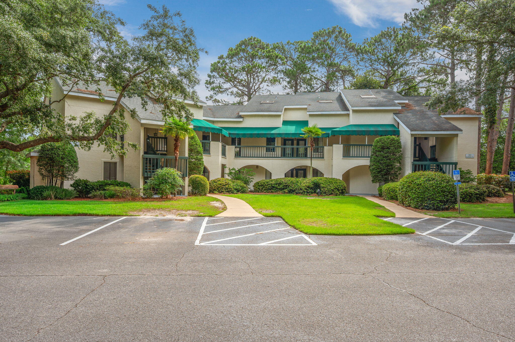Welcome to this lakeside condo in the highly desirable Lakeside community. Offering a spacious, single-level open floor plan, this bright and airy home boasts panoramic views of Bluewater Lake. The living and dining area is flooded with natural light, featuring two sets of sliding glass doors that open to an expansive 27-foot covered balcony overlooking the water. The open-concept kitchen comes complete with modern stainless steel appliances and a large breakfast bar. The primary suite is a true retreat, offering a walk-in closet, a dedicated lakeside sitting area with balcony access, and an en-suite bathroom with a double vanity. A comfortable guest bedroom enjoys direct access to the full guest bath, and a convenient laundry closet sits off the kitchen. Enjoy a low-maintenance, lock-and-leave lifestyle. The $606.41/month HOA fee covers water, sewer, trash, pest control, hazard insurance, exterior maintenance, and groundskeeping. Located right behind the tennis courts, you are steps from resort amenities like golf, pickleball, pools, and the marina and just 15 minutes from Destin's famous white sand beaches. VA approved and move-in ready!