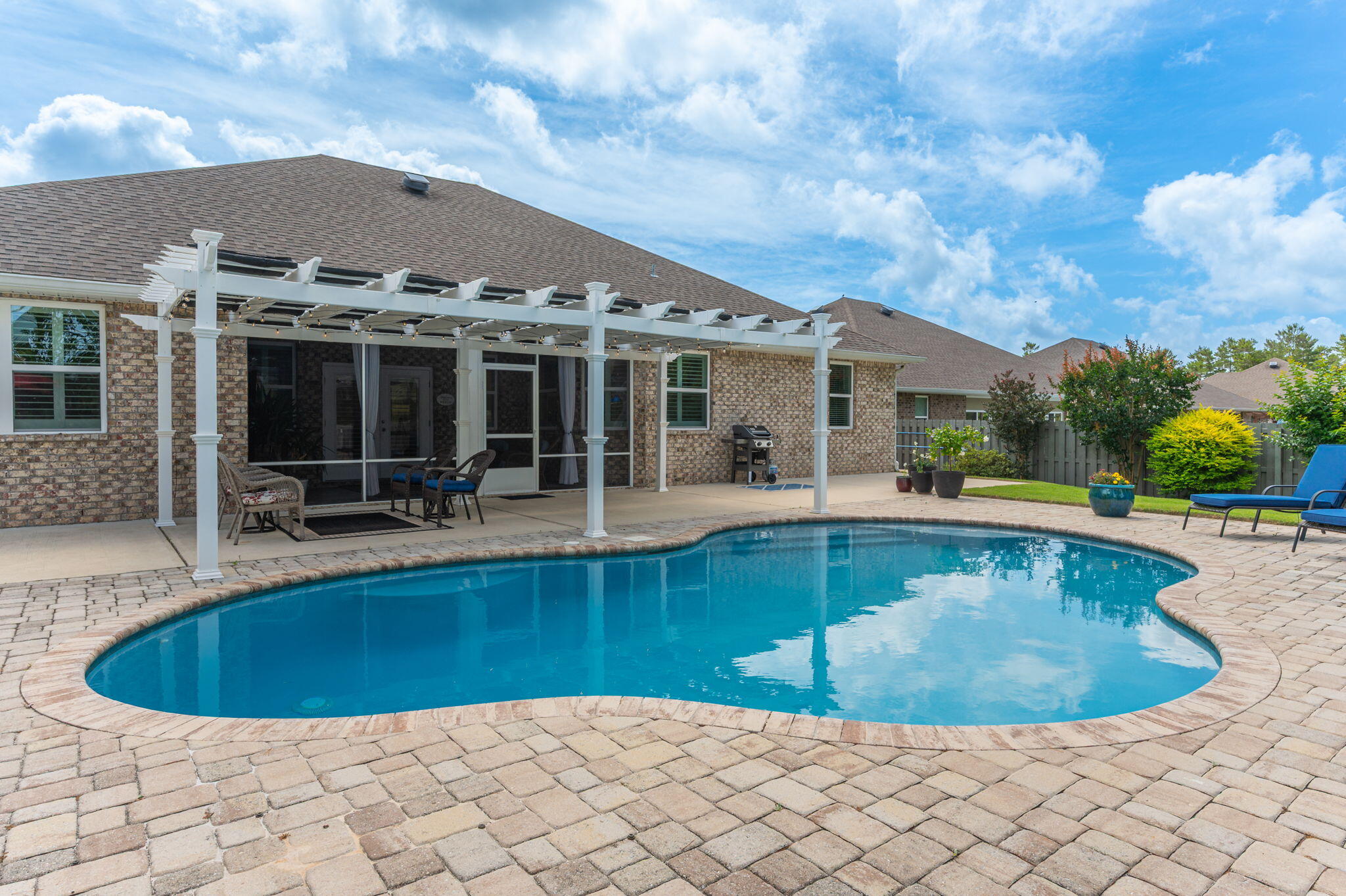 Welcome to 200 Sweet Tea Ln in the sought-after community of Hammock Bay, with resort-style living. This immaculate ranch-style residence offers the ideal blend of luxury, comfort, and functionality with 4 spacious bedrooms, 3 beautifully appointed baths, and an extraordinary backyard retreat with an enticing inground pool & pergola! This pristine home has been thoughtfully enhanced with high-end upgrades throughout. The heart of the home is the stunning, remodeled kitchen, featuring custom cabinet door and drawer fronts, sleek quartz countertops, an expanded quartz island, convenient slide-out drawers in the lower cabinetry, this space is as functional as it is beautiful. Adjacent dining and living areas create seamless flow, making the home feel both spacious and inviting. The luxurious primary suite serves as a peaceful sanctuary, offering generous space and a completely transformed spa-inspired bath. Relax and recharge in the spectacular oversized custom-tiled shower, complemented by a custom vanity with elegant quartz countertops and his & her large walk-in closets, and designer finishes that create a true retreat experience. Even the laundry room has received thoughtful upgrades with beautiful butcher block countertops, blending practicality with elevated design. Additional premium features include a whole-house Culligan water system and an epoxy-coated garage floor with built-in cabinets and ceiling storage racks, showcasing the meticulous care invested into every inch of this property.
Step outside and prepare to fall in love with your own private oasis. The screened-in back porch, with mounted television creates the perfect indoor-outdoor living experience for football Saturdays, relaxing evenings, or entertaining guests year-round. Beyond the porch lies a spectacular backyard retreat featuring a gorgeous inground pool, enticing pergola area, and fully fenced backyard designed for privacy, relaxation, and unforgettable gatherings under the Florida sun.
Living in Hammock Bay means enjoying one of the Emerald Coast's most amenity-rich communities. Residents have access to multiple resort-style pools, a state-of-the-art fitness center, pickleball and tennis courts, basketball courts, expansive playgrounds, scenic walking paths, and a beautiful clubhouse complete with a movie theater. This vibrant master-planned community offers a lifestyle that feels like vacation every single day while still being conveniently located near the beaches of 30A, shopping, dining, and top-rated schools.
Homes of this caliber--combining impeccable condition, luxurious upgrades, exceptional outdoor living, and premier community amenities--rarely become available. Whether you are searching for your forever home, a stunning second residence, or simply a place where every detail has already been perfected, 200 Sweet Tea Lane delivers an unparalleled living experience in one of Northwest Florida's most desirable communities.
This is more than a home, it is a lifestyle.

Amazing Investor Opportunity! 200 Sweet Tea Lane, Freeport, Fl MLS #1002759 in Hammock Bay and 4281 E County Hwy 30A, Unit 204, SRB, Fl MLS # 1001740 can be sold together for $1,365,000.