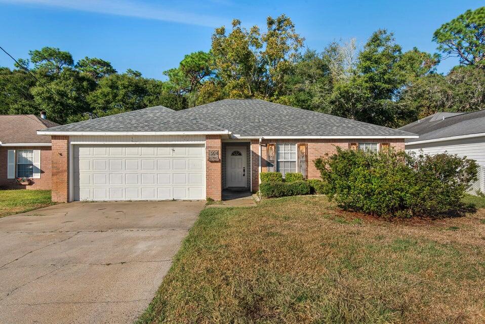 Welcome to 924 Emily Cir in the heart of Fort Walton Beach! This charming single-story 3BR/2BA home offers 1,524 square feet of comfortable living space with an open and inviting layout. The spacious living room features soaring ceilings, abundant natural light, and a cozy fireplace, creating the perfect atmosphere for relaxing or entertaining. The kitchen includes a convenient breakfast bar and overlooks the main living area for easy everyday living. The split floor plan provides functionality and privacy, while both full bathrooms offer comfort and convenience. Enjoy outdoor storage with the shed located in the backyard, ideal for tools, seasonal items, or extra storage needs. Conveniently located between Eglin AFB and the back gate of Hurlburt Field, this home offers quick access to shopping, dining, schools, and local beaches. Owner will allow dogs or cats fully grown up to 50lbs with $350 non-refundable pet fee per pet and $10 per month pet rent per pet. All Coastal Realty Services residents are enrolled in the Resident Benefits Package (RBP) which includes renters insurance, HVAC air filter delivery (for applicable properties) and our best-in-class resident rewards program, and much more!