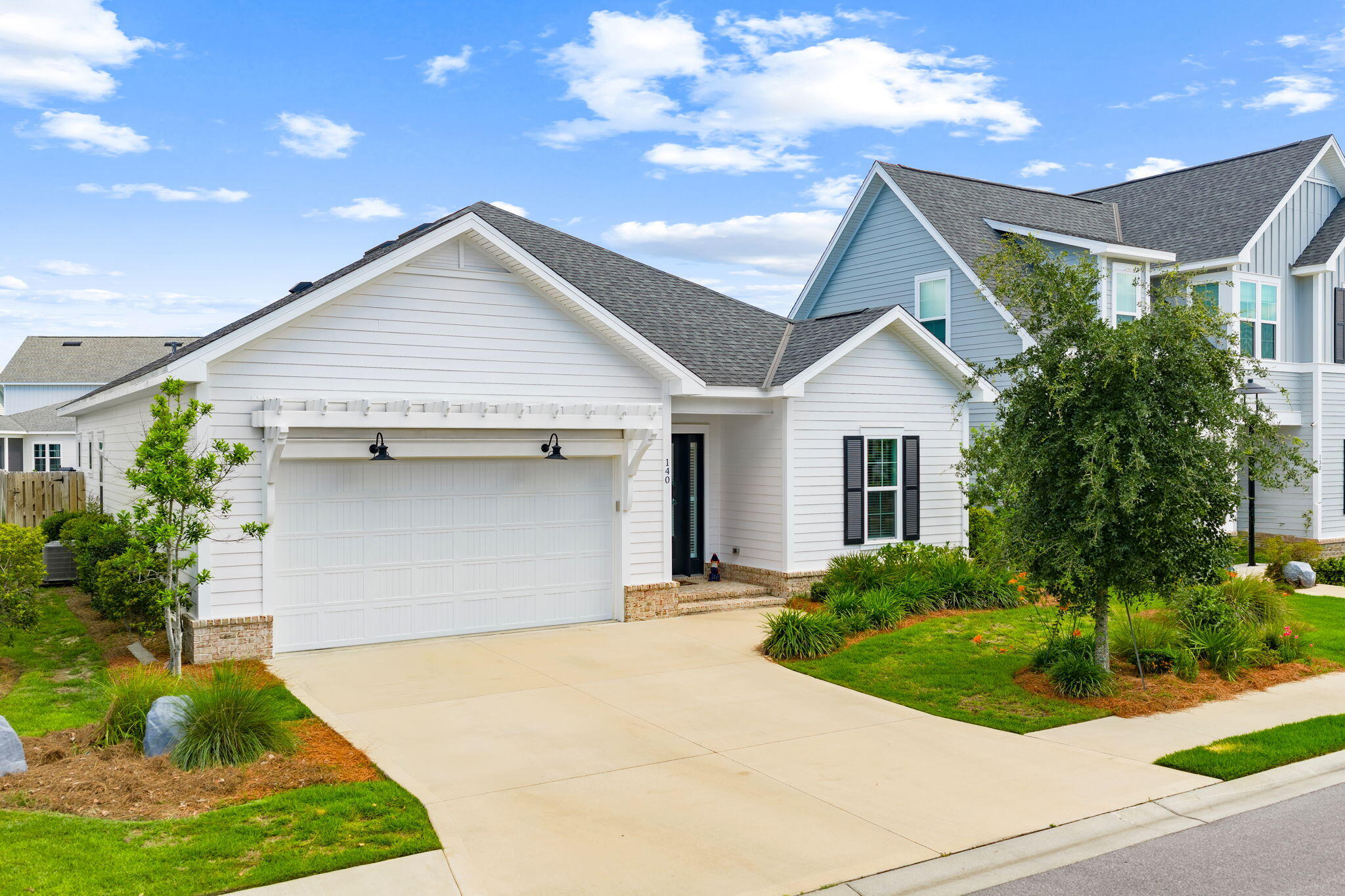 Welcome to effortless coastal living in the highly sought-after Watersound Origins community. This beautifully appointed 4-bedroom, 2.5-bath home offers the perfect blend of style, comfort, and functionality, all thoughtfully designed on a spacious open-concept floor plan.

Step inside to find wide-plank flooring, crown molding, and an abundance of natural light that creates a bright and inviting atmosphere. The kitchen features quartz countertops, custom white cabinetry, stainless steel appliances, a gas range, designer lighting, and a large center island overlooking the living and dining areas, perfect for entertaining family and friends.

The spacious primary suite serves as a private retreat with a spa-like bath and generous closet space, while three additional bedrooms provide flexibility for guests, a home office, or growing families. Every detail has been carefully selected to create a timeless coastal aesthetic.

Outside, enjoy beautifully landscaped grounds and a peaceful pond-view setting, offering the perfect backdrop for morning coffee or relaxing evenings. The home's charming curb appeal and inviting front porch embody the signature style that makes Watersound Origins one of the area's most desirable communities.

Residents enjoy exceptional amenities including resort-style pools, fitness center, tennis and pickleball courts, miles of walking and biking trails, golf at Origins Golf Club, and convenient access to the shops and restaurants of the Watersound Town Center, as well as the white sandy beaches of 30A and the Emerald Coast.