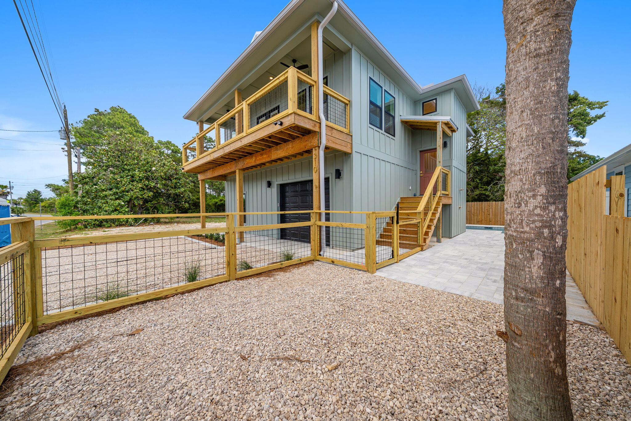 New construction investment opportunity in Panama City Beach designed with both lifestyle and income potential in mind. This fully furnished, turn-key beach house offers a strong short-term rental profile with features today's guests actively search for on Airbnb and VRBO -- private in-ground pool, golf-cart-friendly garage space, covered balcony, and modern coastal finishes. The open-concept layout maximizes guest flow and sleeping capacity potential, with a spacious living and dining area that easily accommodates groups. The well-appointed kitchen features quality finishes ideal for extended stays, while the covered balcony and resort-style pool create the outdoor experience vacationers expect when booking a Panama City Beach rental. Built with elevated construction, a metal roof, and durable exterior materials, this property was thoughtfully designed for longevity, lower maintenance, and long-term holding value -- key factors for investors focused on ROI and asset protection. The attached garage provides storage for beach gear, owner closets, or a golf cart, enhancing rental appeal and convenience. This property allows for immediate income production with minimal downtime between closing and first booking. The flexible floor plan supports use as a high-performing short-term rental, second home with rental income, or primary residence with supplemental income potential. Located just minutes from the white-sand beaches of the Gulf of Mexico, Pier Park shopping and dining, 30A, Camp Helen State Park, and Northwest Florida Beaches International Airport (ECP), this home sits in a high-demand rental corridor known for strong seasonal occupancy. Whether you are expanding your investment portfolio, completing a 1031 exchange, or securing a beach asset with appreciation and income potential, this Panama City Beach pool home delivers location, lifestyle, and revenue opportunity in one strategic package.