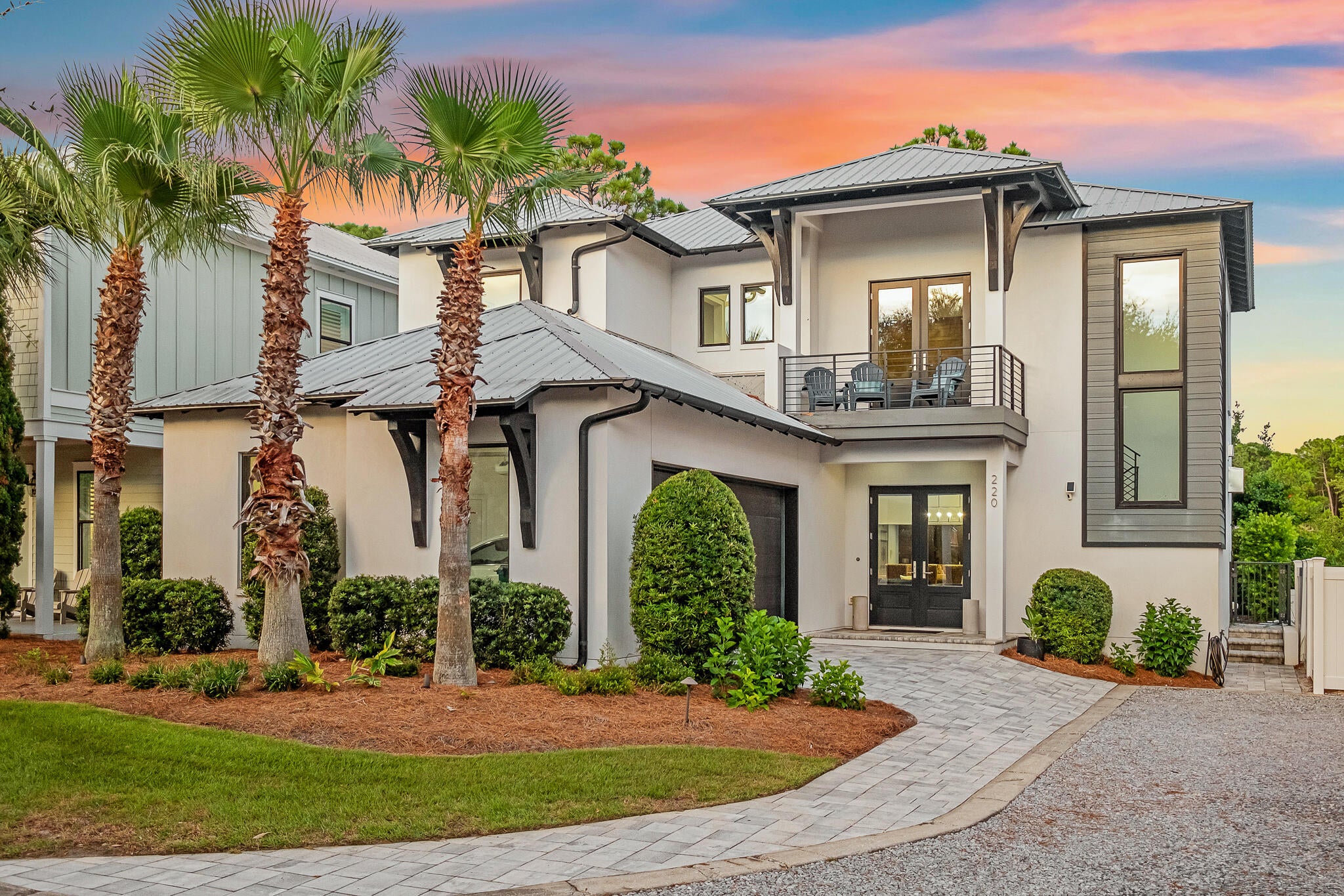 A private courtyard pool anchors this fully furnished contemporary residence in gated Emerald Waters Village, bringing resort-style outdoor living to the center of the home. Built in 2019 and spanning approximately 3,155 square feet across two levels, the residence offers seven sleeping rooms and four baths, a two-car garage, and accommodations for up to 16 guests.  Deeded beach access, easily reached through the footpath and gate from the community to ''Old 98''. 

Rather than placing the pool behind the house, the architecture wraps around it, with floor-to-ceiling black-framed glass along two sides and a covered loggia on the third. The kitchen, living and dining areas open directly to the courtyard, keeping the water in view throughout much of the main level. The result is a pool that functions as a second living room rather than a separate outdoor amenity.

Under the covered loggia, a plank wood ceiling, recessed lighting and ceiling fan create a comfortable gathering space with a mounted television, built-in grill and dining area. Travertine pavers, river-rock borders, mosaic waterline tile and color-changing pool lighting complete the courtyard, extending its use from afternoons by the water to dinner and night swimming.

Inside, raised ceilings, hardwood and tile flooring, designer lighting and warm wood accents give the contemporary interiors texture and depth. The kitchen centers on a waterfall-edge island and Thermador appliances, while a linear gas fireplace A private courtyard pool anchors this fully furnished contemporary residence in gated Emerald Waters Village, bringing resort-style outdoor living to the center of the home. Built in 2019 and spanning approximately 3,155 square feet across two levels, the residence offers seven sleeping rooms and four baths, a two-car garage, and accommodations for up to 16 guests. Deeded beach access, easily reached through the footpath and gate from the community to "Old 98". 

Under the covered loggia, a plank wood ceiling, recessed lighting and ceiling fan create a comfortable gathering space with a mounted television, built-in grill and dining area. Travertine pavers, river-rock borders, mosaic waterline tile and color-changing pool lighting complete the courtyard, extending its use from afternoons by the water to dinner and night swimming.

Inside, raised ceilings, hardwood and tile flooring, designer lighting and warm wood accents give the contemporary interiors texture and depth. The kitchen centers on a waterfall-edge island and Thermador appliances, while a linear gas fireplace anchors a wood-clad feature wall. The first-floor primary suite includes a sitting area and walk-in closet. 

Upstairs,  a wet bar and a second family room provides the perfect gathering space and creates separation among the sleeping areas, while bunk accommodations contribute to the home's guest capacity. Built-in shelving, a wet bar and an owner's closet add functionality for both personal stays and rental use.

The property is offered fully furnished with a two-car garage and additional driveway parking. Emerald Waters Village is a gated, short-term-rental-friendly community with two community pools, including one just steps from the home. Positioned on a cul-de-sac and steps from the beach pedestrian gate to the deeded beach access. The golf-cart-friendly location sits between Destin and 30A, with Grand Boulevard, Baytowne Wharf, Silver Sands and the restaurants, shopping and entertainment of the Emerald Coast within easy reach.

With a private pool at the heart of the architecture, accommodations for up to 16 and an established rental setup, the home combines the features of a coastal retreat with the practical advantages of a turnkey second home or investment property.