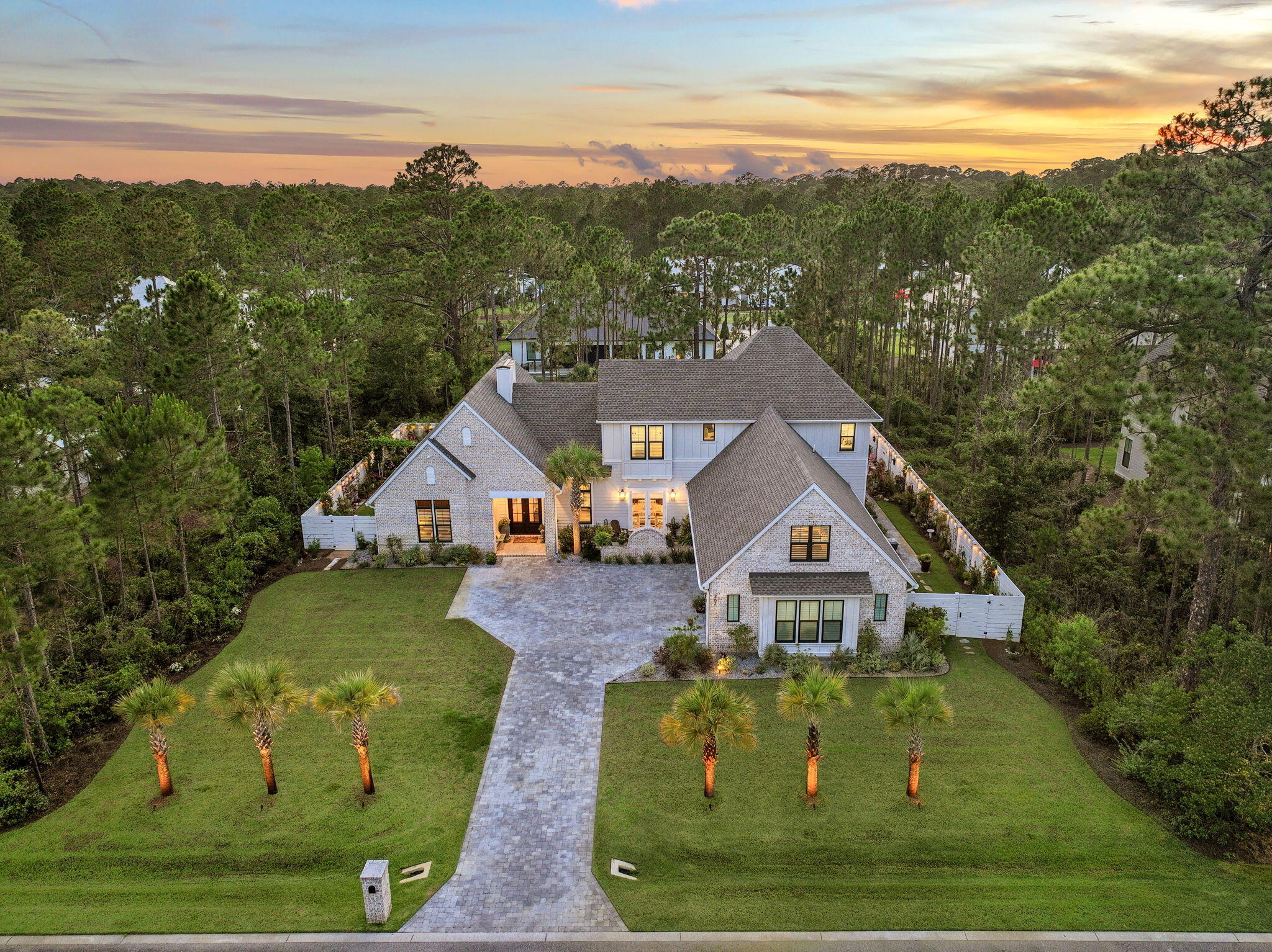 Why wait to build when this exceptional 2023 custom-built estate has already been thoughtfully upgraded and finished for you? Tucked behind the gates of Seclusion Bay, this beautifully appointed residence offers 3,866 square feet of refined living space, five bedrooms, four baths, and an extensive investment in owner upgrades. Set on a beautifully landscaped homesite framed by towering pines, the property combines elevated craftsmanship with the relaxed luxury of life along 30A.

From the moment you arrive, the home's custom character and lush landscaping create an inviting first impression. Inside, light oak flooring, abundant natural light, and a warm, sophisticated palette create an atmosphere that feels both polished and comfortable. The chef's kitchen is designed for everyday living and effortless entertaining, featuring crisp white shaker cabinetry, quartz countertops, a designer tile backsplash, and a professional gas range with pot filler. Spacious bedrooms and spa-inspired baths provide comfort and privacy throughout the home.

Beyond the five bedrooms, the upstairs living space sets this home apart. A generous bonus room, cozy loft, and convenient mini kitchen with refrigerator create an exceptional secondary living area, offering endless flexibility for a family room, game room, home theater, game room, or private entertaining retreat.

Outdoor living is equally impressive. The screened and paver-decked pool area serves as the centerpiece of a private backyard designed for both relaxation and entertaining. A brand-new Hayward pool heater installed in 2025 and app-controlled pool lighting make the space enjoyable well beyond the summer months. Extensive custom landscaping surrounds multiple outdoor living areas, including distinctive crushed Bahama-rock seating areas and pre-wired pads ready for future waterfalls and additional landscape lighting.

The thoughtful upgrades continue with a monitored security system and pre-wired infrastructure for security cameras, providing both convenience and peace of mind. Every detail has been considered to create a home that is move-in ready while still offering the character and customization of a true custom residence.

Seclusion Bay offers the rare combination of gated privacy and an exceptional location, with residents enjoying access to a private community dock perfect for boating, paddleboarding, fishing, and gathering for unforgettable sunsets on the bay.

Just minutes from the beaches, dining, boutiques, and lifestyle that make Scenic 30A one of the most sought-after destinations on the Gulf Coast, this exceptional estate delivers the space, upgrades, privacy, and location today's buyers are looking for. A rare opportunity to enjoy the best of 30A without the wait or expense of building from scratch. Schedule your private tour today.