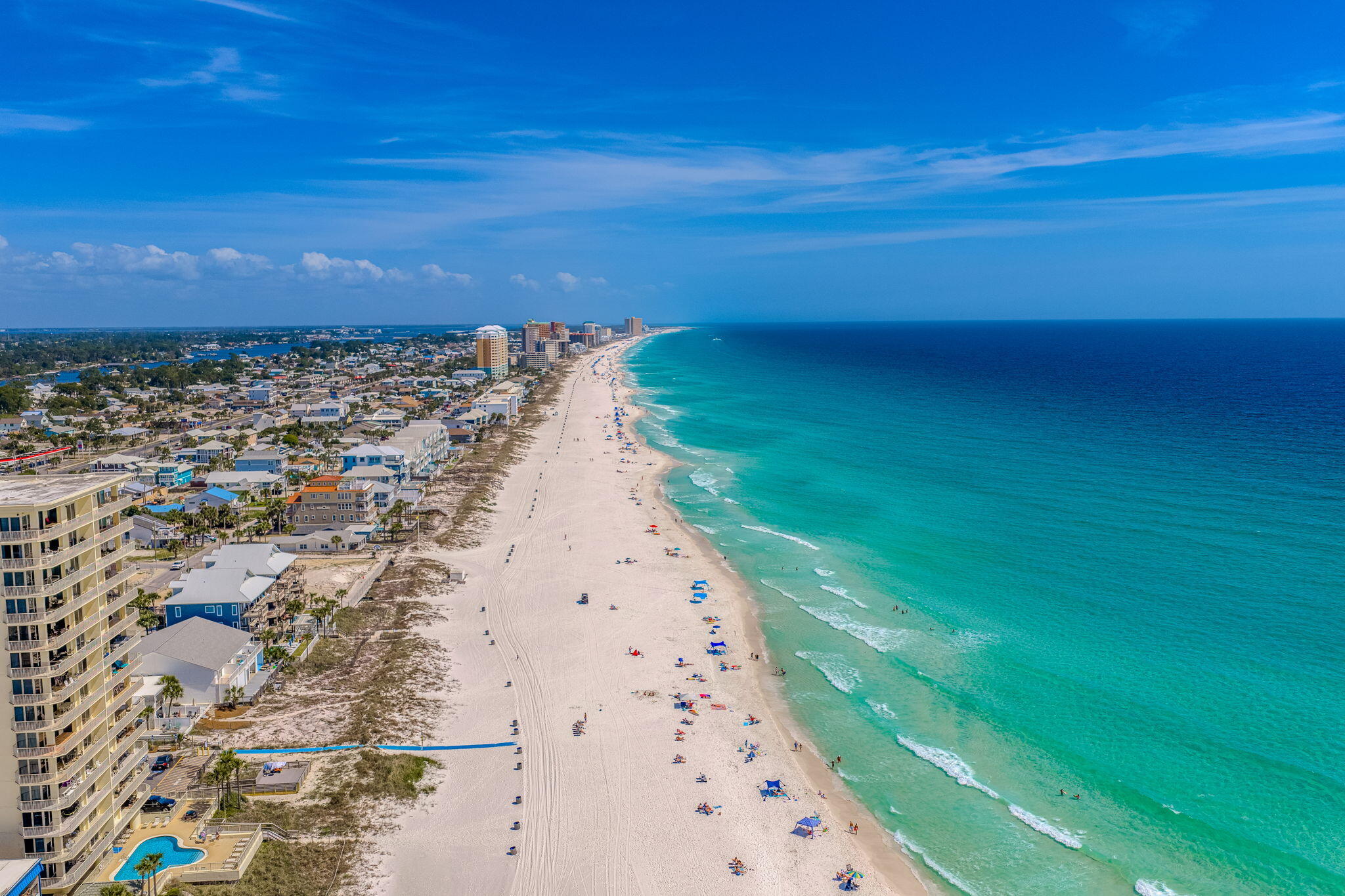 Directly across the street from the Gulf, this 2 bedroom, 2 bathroom townhome offers quick beach access, Gulf views, and updates that help reduce near-term maintenance. Two public beach access points are nearby, and the home is being sold fully furnished, making it a practical option for personal use, a second home, or rental use. For buyers exploring added rental flexibility, the neighboring townhome is also available, creating a rare opportunity to own side-by-side units.

Inside, the layout is set up to comfortably host guests with one king bed and two queen beds. The kitchen, bathrooms, and flooring were renovated in 2019, and the entire unit was freshly painted in 2025, including the walls, trim, and doors. All furnishings were also replaced in 2025, giving the interior a clean, updated feel. A full-size washer and dryer adds everyday convenience.

The living area opens to a private patio where you can enjoy Gulf views and coastal breezes. A fenced backyard provides private outdoor space to unwind after time at the beach. The home also includes a private garage for beach gear, bikes, and other coastal essentials, plus additional driveway parking for guests.

Nearby destinations include Pier Park, St. Andrews State Park, marinas, waterfront dining, shopping, and local restaurants. Buyer to verify all dimensions.