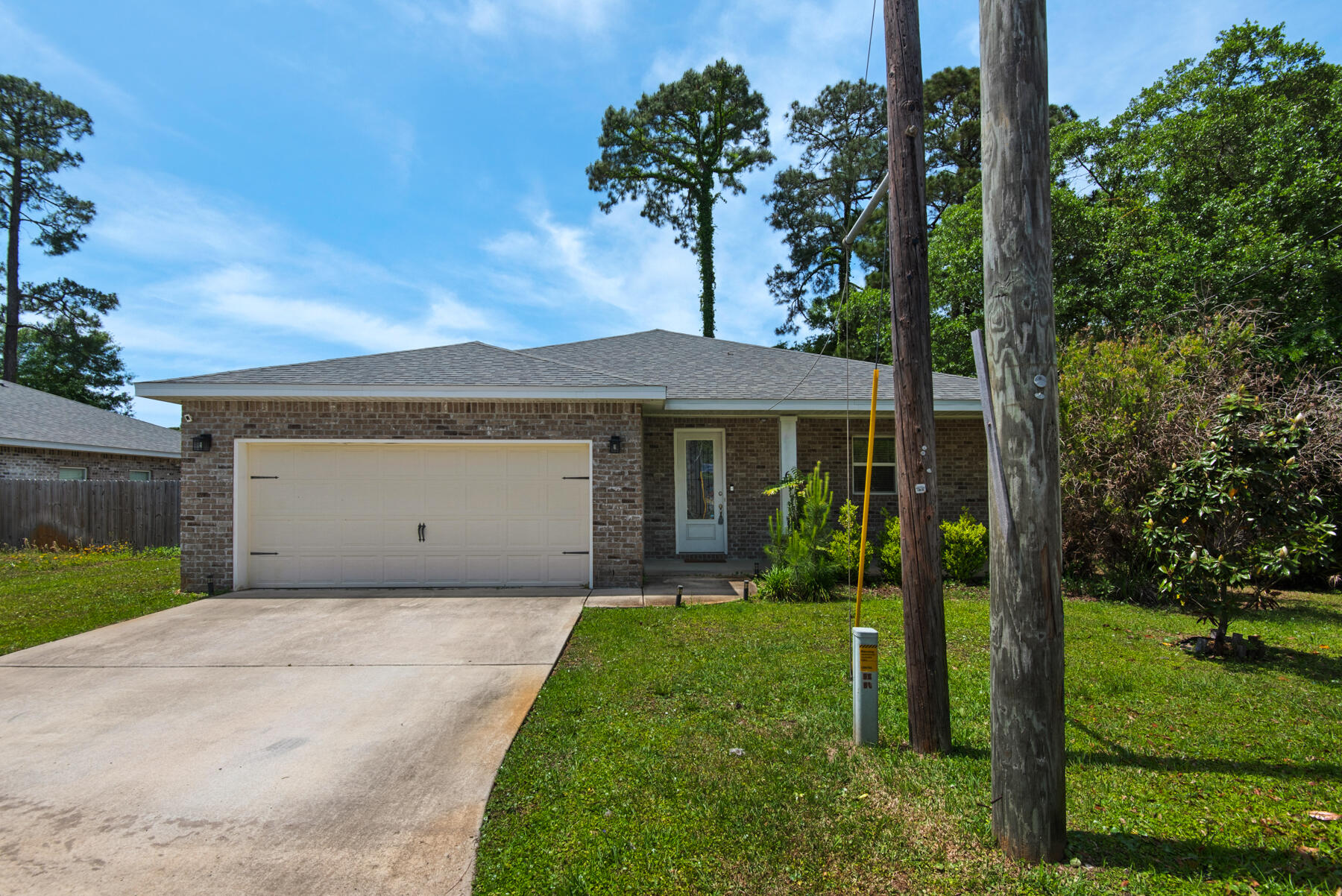 $200.00 Off First Full Month's Rent! Enjoy modern living in this open-concept home featuring a spacious kitchen with stainless steel appliances and a convenient breakfast bar. The master suite offers double sinks, quartz vanity tops, a tiled walk-in shower, and a relaxing soaking tub. The fully fenced backyard and covered back porch are perfect for entertaining. Ideally located just 9 miles from Navarre Beach and 15 minutes from downtown Fort Walton Beach, with easy access to Hurlburt Field and Eglin AFB. With an approved pet application, owner will allow fully grown dogs or cats up to 75 lbs or less with a $350 non-refundable pet fee for each pet and $10 per month for each pet. Residents are enrolled in the Coastal Realty Services Resident Benefits Package (RBP), which includes renters insurance, HVAC air filter delivery, a resident rewards program, and more!