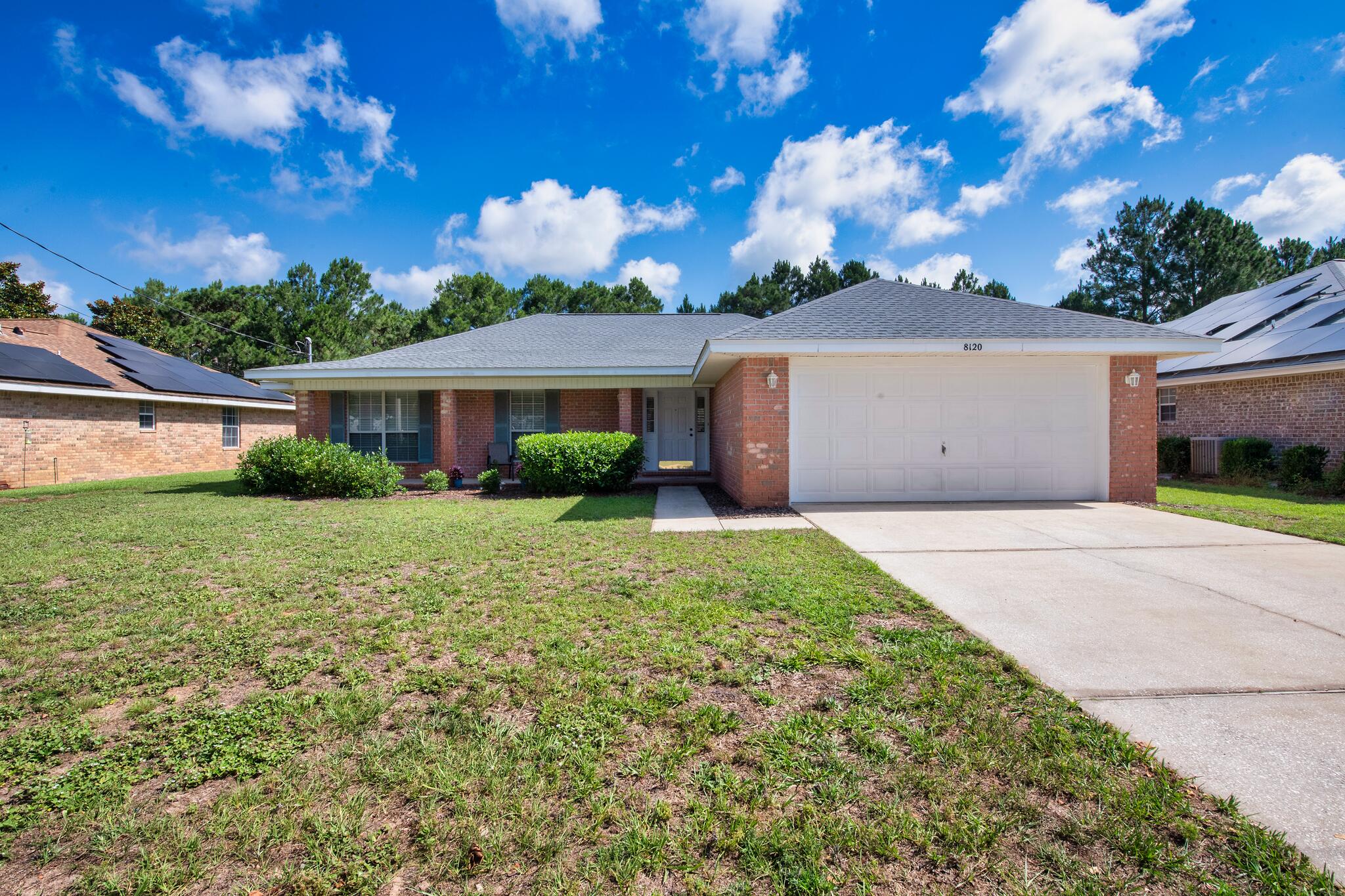 Step inside and you'll find the kind of space that's becoming harder to find in Navarre. With over 1,800 square feet, 4 bedrooms, 2 bathrooms, and multiple living areas, this home offers room to spread out without feeling disconnected.

The main living area features vaulted ceilings and durable porcelain tile flooring installed just a few years ago, creating an open and comfortable space for everyday life. The kitchen overlooks the living and dining areas, making it easy to stay connected whether you're preparing dinner, helping with homework, or hosting friends/family.

The real standout is the enclosed Florida room. Complete with its own heating and cooling system, it's a space you can enjoy year-round. Whether it becomes your favorite place for morning coffee, a game room, home office, workout space, or simply a spot to unwind at the end of the day, it adds a level of flexibility that few homes in this price range offer.

Outside, the fully fenced backyard provides plenty of room for kids, pets, gardening, or future plans. With no HOA, you'll have the freedom to enjoy your property without additional restrictions or monthly dues.

Major updates include a roof replaced in 2021, HVAC system installed in 2019, porcelain tile flooring added approximately 3-4 years ago, and the washer and dryer convey with the home.

Conveniently located just minutes from Navarre Beach, shopping, restaurants, and Hurlburt Field, this home offers space, flexibility, and a great location.