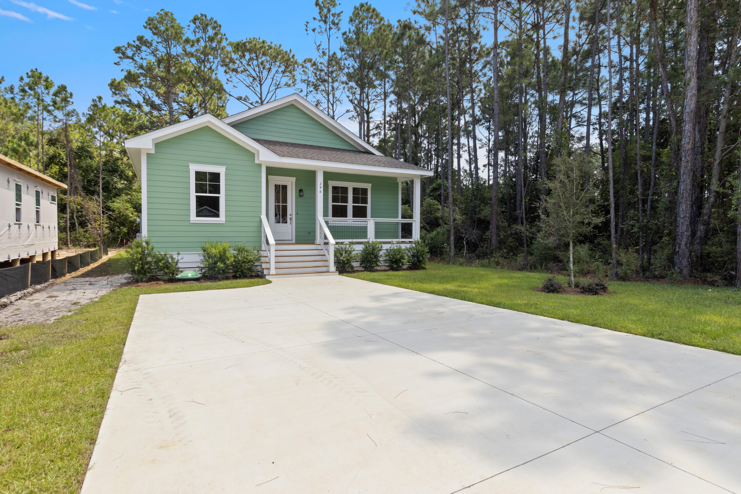 This beautifully finished 3 bed, 2.5 bath home offers 1,398 sqft of stylish comfort just 10 minutes from the beach! Featuring LVP flooring, tile showers, shiplap accents, vaulted and trey ceilings, crown molding, and a fenced backyard -- all with no HOA. Prime location near the bay and the future Chat Holley park & amphitheatre makes it perfect as a full-time home or a high-performing rental! Construction complete as of 9/1/2025! Seller will install a wood privacy fence with an acceptable offer. Watch the Youtube video here: https://www.youtube.com/watch?v=KK6thdyELSs