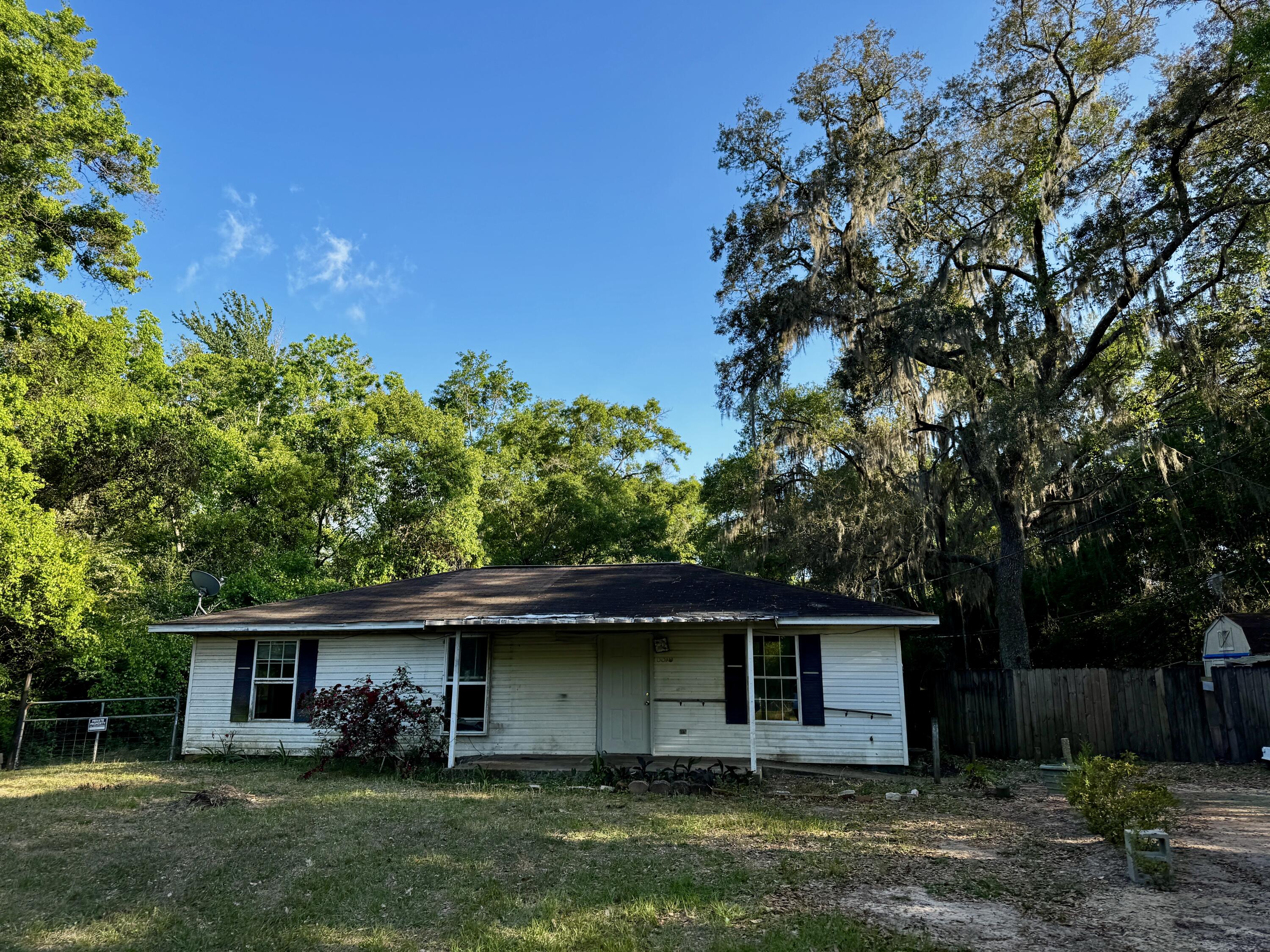 Handyman Special with a Backyard Paradise! Bring your toolbelt and your imagination to this 3-bedroom, 1-bathroom home bursting with potential. Perfect for investors, flippers, or handy homeowners looking to build immediate sweat equity. No HOA and RV Outlet in backyard. The interior requires repairs and cosmetic updates, but the bones are here to create your dream space. Property was built to be handicap accessible. The true highlight of this property is the spectacular, expansive backyard. The beautiful, lush yard offers a private oasis perfect for gardening, entertaining, or future expansion. The property is being sold strictly AS-IS, and the seller will make no repairs. Cash or renovation loans (like FHA 203k) are preferred due to the current condition. Close to public boat ramp and Carpenter's Park.  Do not miss this incredible opportunity to renovate, restore, and reap the rewards! Schedule your showing today.
