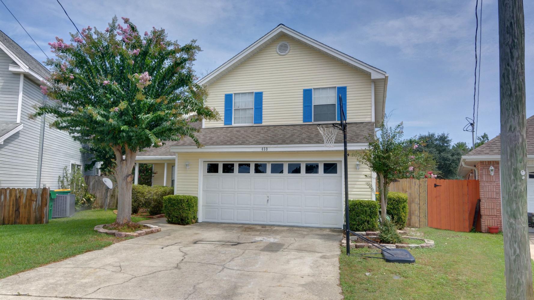 Beautifully kept 3brm/2.5ba, 2 story home minutes from Hurlburt Field. Newly painted, this home features a spacious living room with a wood-burning fireplace, and looks out onto the back patio through french doors. A formal dining room is adjacent to the living room. The kitchen is large and airy, and is the perfect size to house a breakfast nook. Gorgeous wood laminate flooring throughout the main floor and carpeted bedrooms and hall upstairs. The master bathroom overlooks the backyard, and features a double vanity and a walk in closet. Jack and Jill style second and third bedrooms overlook the street, and are both equipped with large closets. The back yard has a shed and a workshop, and the back deck is perfect for enjoying our warm Florida evenings! Come by today!