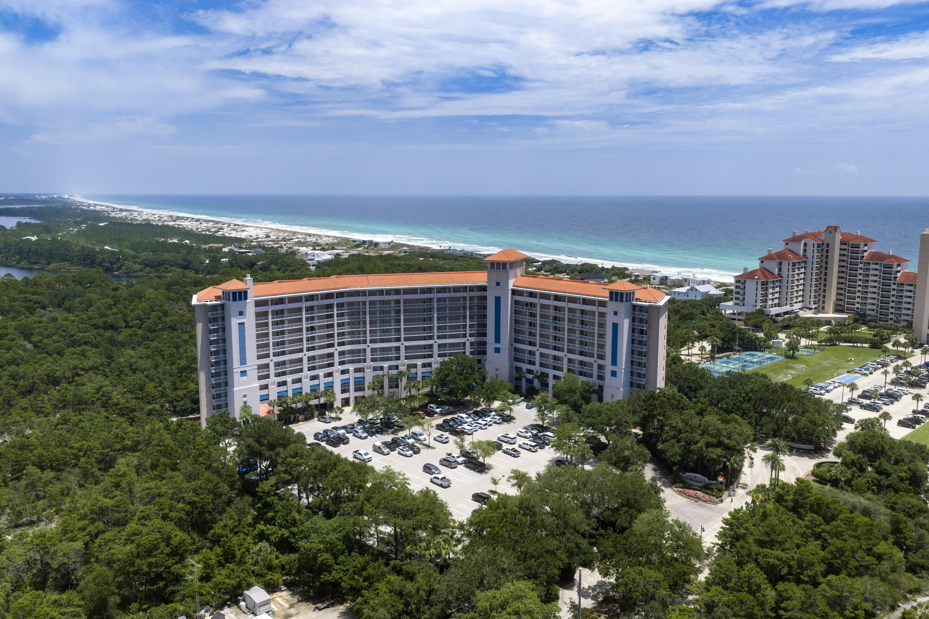 Enjoy effortless beach living from this beautifully updated first-floor condo overlooking the beauty of Coffeen Nature Preserve. With easy access to both the beach and pool, you'll love skipping the elevators and being steps away from resort amenities.  Take a short stroll to the beachfront pool, pavilion, and grill, or hop on the convenient air-conditioned tram for a relaxing ride to the sugar-white sand beaches. Located within TOPS'L Beach & Racquet Resort, one of the nation's premier beach and tennis destinations, residents enjoy 24-hour gated security, 12 lighted tennis courts, a state-of-the-art fitness center, indoor and outdoor pools, private beach access and a scenic 1.3-mile fitness.  Since the owners purchased the condo in 2012, over $100,000 has been invested in renovations and improvements. The kitchen, bathrooms, flooring, furnishings, and décor have all been thoughtfully updated, creating a stylish and comfortable coastal retreat. The owners have continually refreshed the furniture and artwork, keeping the home current and inviting.  One of the standout features is the spacious private deck, furnished with beautiful, high-quality outdoor furniture designed for durability and comfort. It's the perfect place to enjoy morning coffee, afternoon breezes, or unwind after a day at the beach while taking in the peaceful preserve views. Whether you're seeking a primary residence, vacation getaway, or investment property, this turnkey condo offers the perfect combination of luxury, convenience, and resort-style living.  The building roof was replaced in 2025. Pool was resurfaced in 2022. The pool bathrooms were remodeled in 2024.  There are plans to repaint the building in 2028.. SIRS is fully funded.  No special assessments are planned at this time.