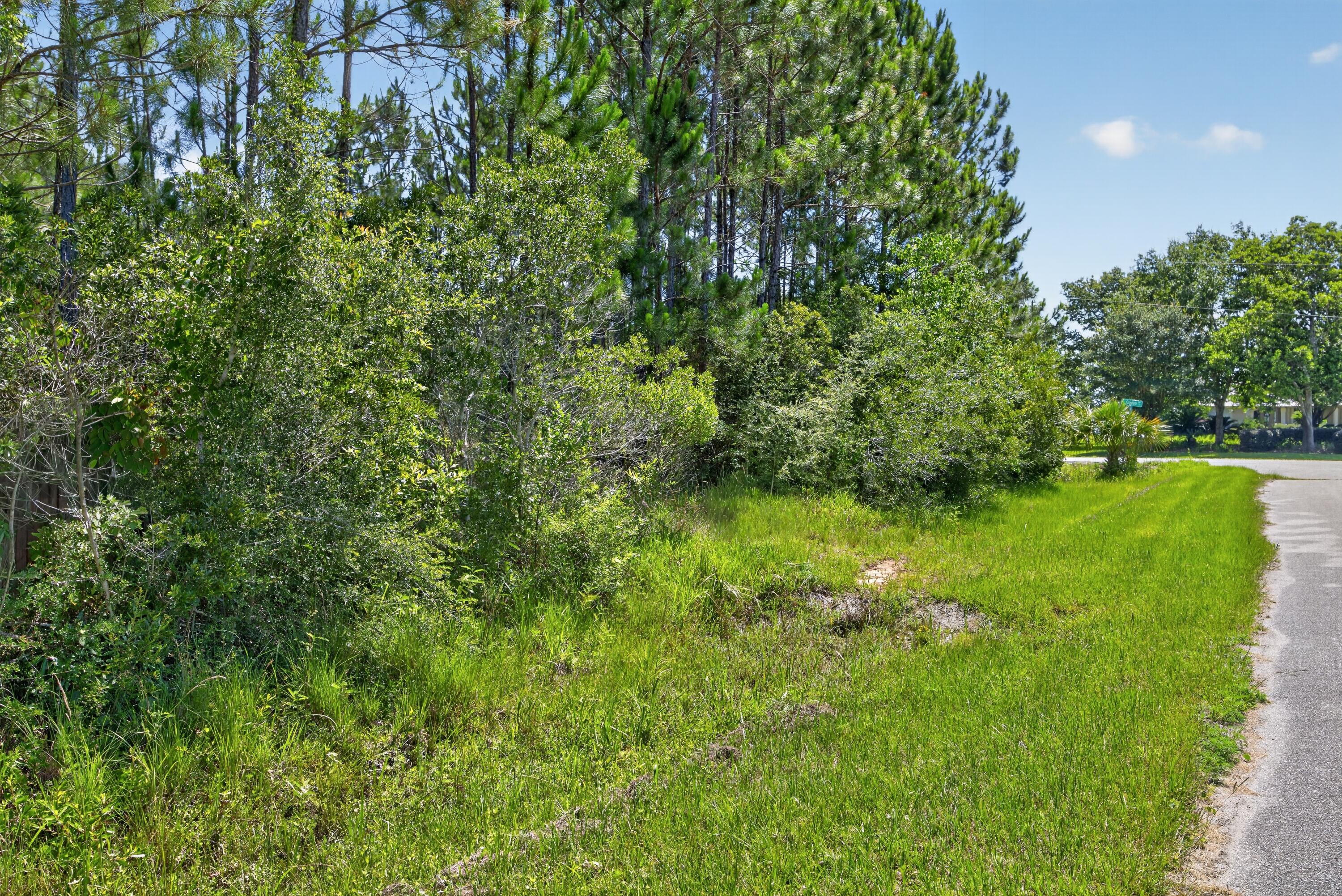 Beautiful 2.27 Acre Bayview homesite in Milton's Avalon Beach Area! Offering scenic water views, privacy, and plenty of room to build your custom dream home, pool, workshop and outdoor living space. You don't want to miss this rare opportunity of peaceful coastal living. Buyer to verify zoning, utilities, wetlands, building requirements and all information deemed important.