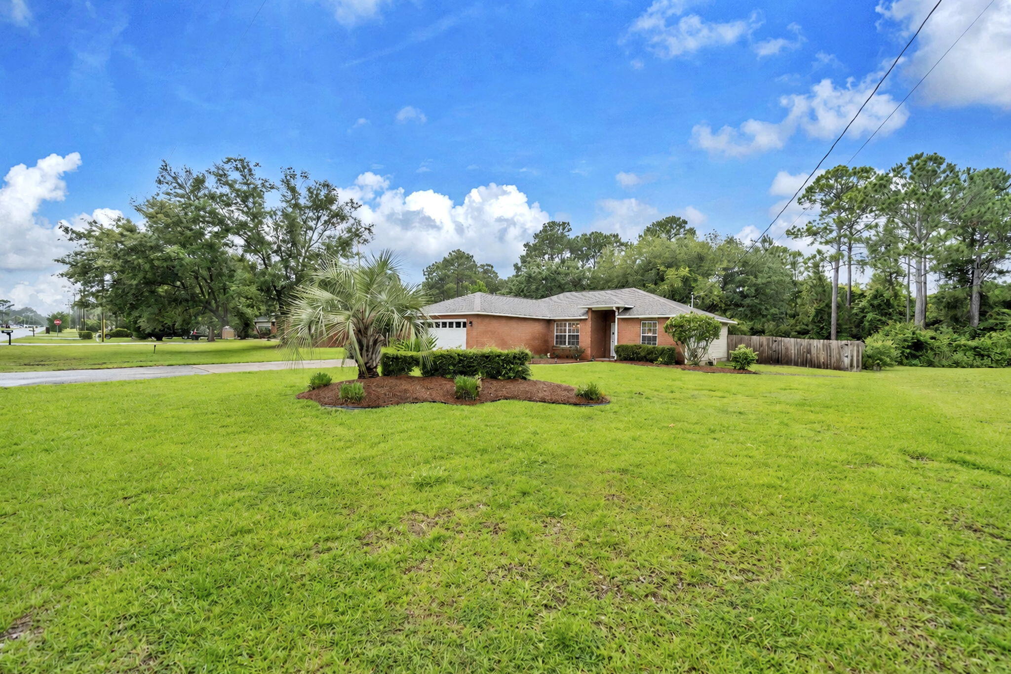 In Holley by the Sea, pool homes are limited on the current market, making this 3-bedroom, 2-bath Navarre home stand out for its private gunite pool, large 0.46-acre lot, major system updates, and location near Navarre Beach. The home includes a 2021 roof, 2024 HVAC system, hurricane shutters, and high-speed fiber internet already wired into the house.

Inside, the home has been refreshed with updates that support a clean, cared-for feel. Popcorn ceilings have been removed, new appliances have been added, and new fixtures, ceiling fans, and door hardware give the interior a more polished finish. The primary bathroom tub and shower have also been freshly resurfaced and reglazed.

The gunite pool is a key feature, offering a durable outdoor living space with strong appeal in a low-inventory pool home market. Pool updates include a new pool vacuum, new pool cell, new pool light, new flood lights, replaced sand in the pool filter, and a new pressure gauge. The 0.46-acre lot adds usable outdoor space around the home, giving buyers more room to enjoy the pool area, yard, and exterior setting.

Outside, the property has received a thoughtful curb appeal refresh. The garage door, soffits, and window trim have been painted, fresh pine straw has been added, and trees have been trimmed. The pool deck, front driveway, and fence have also been pressure washed to help the exterior feel clean and well maintained. Located in Holley by the Sea, this Navarre home offers access to community amenities and a convenient location near Navarre Beach, Hurlburt Field, Eglin Air Force Base, shopping, dining, and everyday services. A transferable termite bond is in place at $325 per year. Buyer to verify all dimensions.