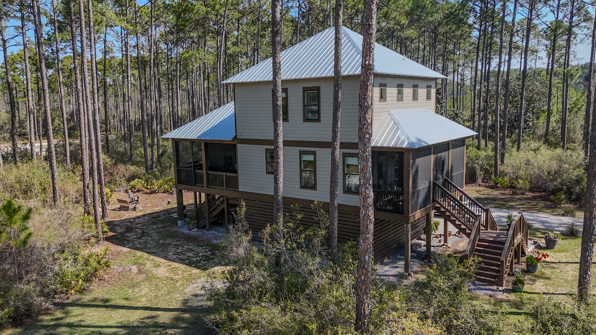 Featured in Coastal Living and Southern Living, RiverCamps at Crooked Creek is one of the Gulf Coast's most exclusive gated communities, where refined living meets untouched natural beauty. This is a rare opportunity to own within this highly desirable community at an exceptional value.

Privately set on over an acre of preserved landscape, this move-in ready 3-bedroom, 3.5-bath residence offers an effortless blend of sophistication and comfort. The open-concept design is complemented by quality finishes, abundant natural light, and seamless indoor-outdoor flow, ideal for both relaxed living and upscale entertaining.

A true fisherman's and boater's paradise, RiverCamps offers direct Gulf access via private boat ramp, along with day-use slips, a riverfront pool, fitness center, and miles of scenic trails through protected Florida wilderness.

Located just minutes from the beaches, dining, and shopping of Panama City Beach, yet worlds away in privacy and tranquility. A rare offering in one of the Emerald Coast's most distinctive communities.