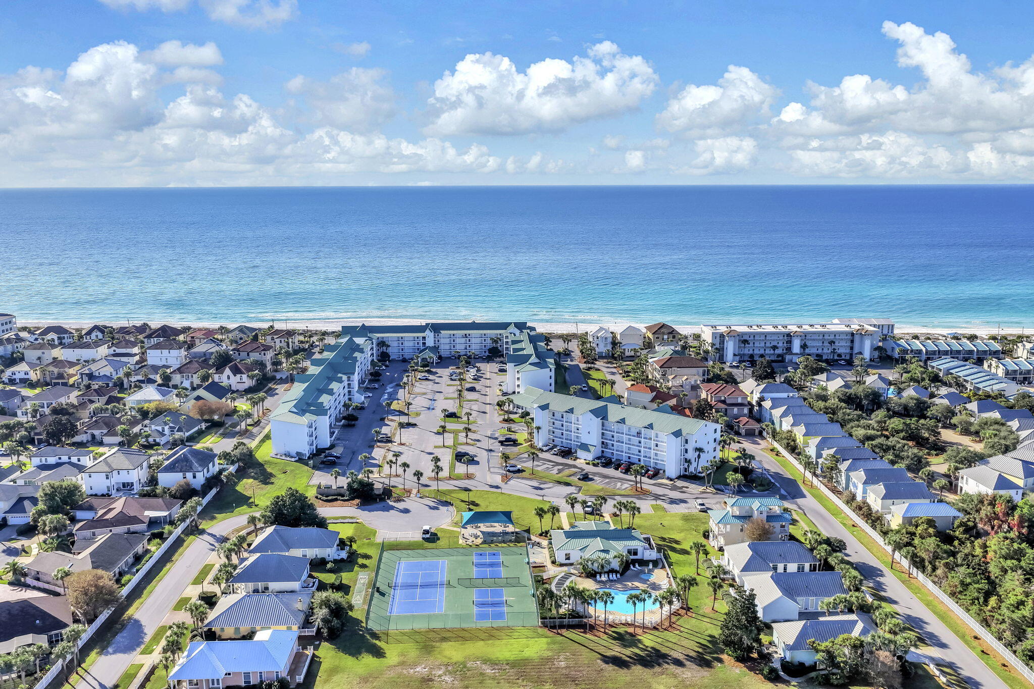Completely renovated from top to bottom, this beautifully updated 1-bedroom, 1.5-bath condominium in Maravilla offers stylish coastal living with excellent rental potential. The open-concept kitchen features a stunning quartz waterfall island with shiplap detailing, shaker cabinetry, a bold designer backsplash, stainless steel appliances, and upgraded designer plumbing and electrical fixtures. The spacious living area and private balcony capture beautiful views of the Gulf of Mexico, creating the perfect setting to relax after a day at the beach. The thoughtfully designed floor plan includes built-in hallway bunks for additional sleeping accommodations, making this property ideal as a vacation home or investment property. The primary suite has been completely updated with a luxurious marble-surround walk-in shower and high-end finishes throughout. Maravilla is one of Miramar Beach's most sought-after, pet-friendly communities, offering private deeded beach access along the Gulf of Mexico plus an outstanding collection of resort-style amenities including two swimming pools, a hot tub, fitness center, tennis courts, pickleball courts, and basketball courts. Whether you're searching for a primary residence, second home, or income-producing vacation rental, this turnkey condominium is ready to enjoy from day one.