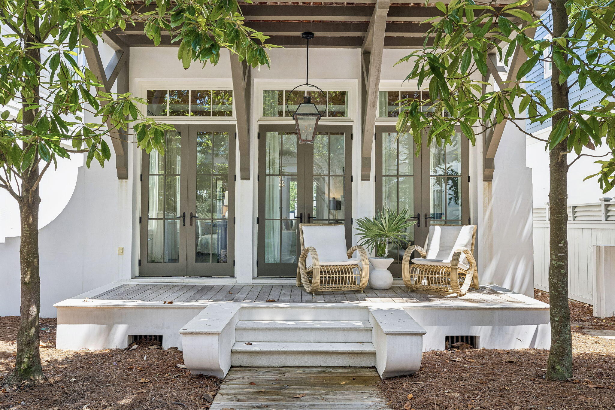 Nestled on a peaceful boardwalk in desirable Rosemary Beach, this charming beach cottage is a perfect blend of elegance and comfort. Designed by renowned architect Ron Domin, the home captures the essence of relaxed coastal living while offering easy access and a short stroll to all the community amenities and steps to the gym and sky pool. Upon entry, an open-concept design seamlessly connects the gourmet kitchen, dining, and living areas. Natural light pours in through an array of french doors and windows, highlighting the beautiful hardwood floors and exposed timber beams that give the space a warm, inviting feel. Thoughtful details enhance its functionality, including a convenient powder room with direct access to an outdoor shower, ideal for rinsing off after a day at the beach. Upstairs, you'll find three spacious bedrooms, each with an marble en-suite bathroom, ensuring comfort and privacy for family and guests. The primary suite features a luxurious marble spa bath and a generous porch overlooking the serene boardwalk. An additional bedroom and a large bunk room provide ample space for everyone. This home truly embodies the spirit of Rosemary Beach living.