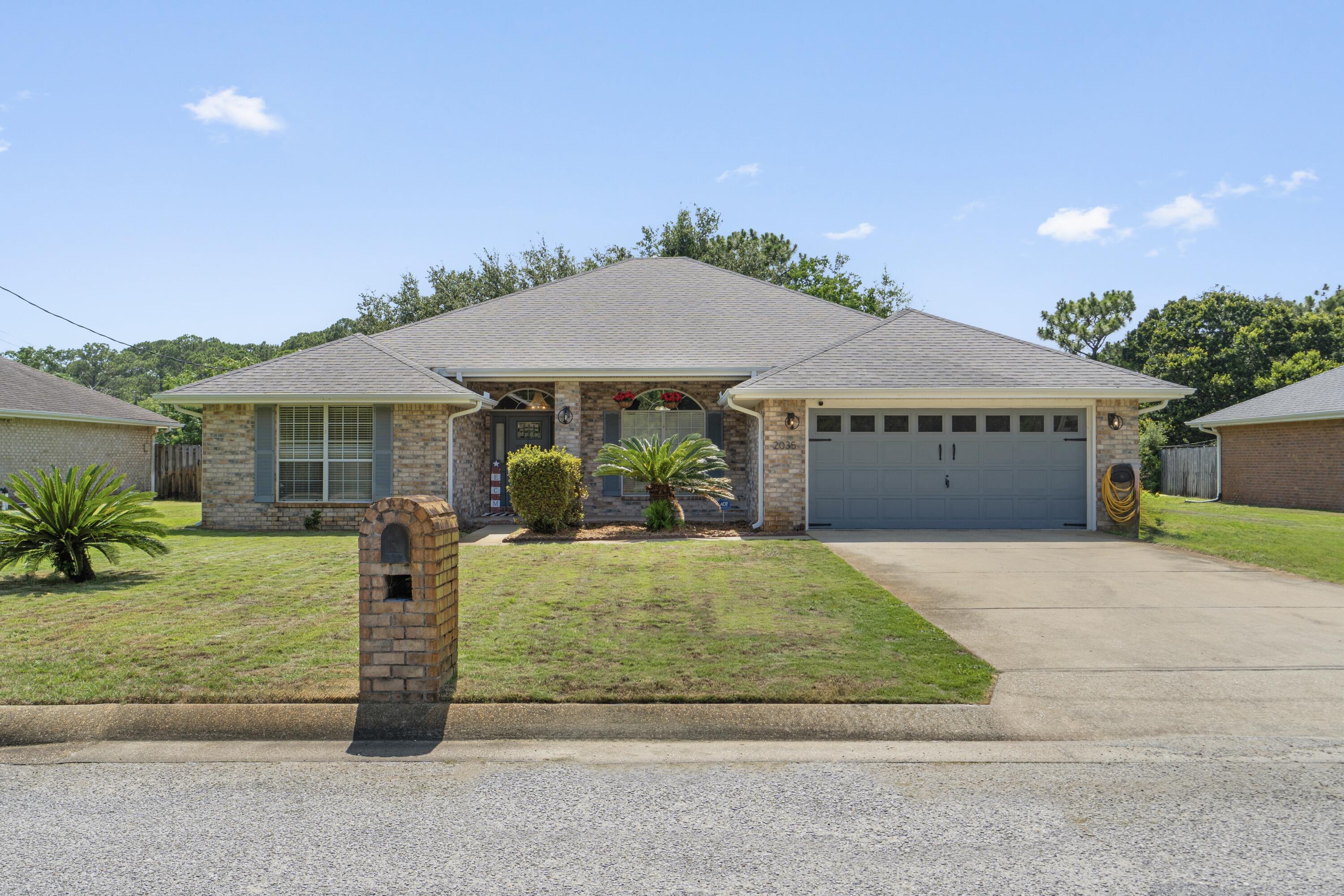 Bring the boat, RV, and all the outdoor toys because this one comes with something buyers are always looking for... space and freedom with NO HOA.
Welcome to 2035 Alfred Boulevard, a well-maintained 4-bedroom, 2-bath home featuring a functional split-bedroom floor plan, soaring vaulted ceilings in the living room, and thoughtful updates throughout. Fresh landscaping and a recently pressure-washed exterior create great curb appeal, while inside you'll find an updated kitchen with quartz countertops, tiled backsplash, and plenty of workspace for everyday living and entertaining.
The oversized primary suite offers a comfortable retreat with an en-suite bathroom featuring quartz countertops. Brand-new luxury vinyl plank flooring has been installed in all bedrooms, complementing the existing flooring throughout the remainder of the home. A versatile bonus room provides endless possibilities as a home office, fitness room, hobby space, media room, or flex area.
Outside, enjoy a fully fenced backyard with room to relax, entertain, garden, or simply enjoy the outdoors. The sprinkler system is connected to a private well, helping keep the landscaping looking its best. Additional parking alongside the home provides space for a boat, RV, trailer, or other recreational equipment.
Conveniently located near Navarre's white-sand beaches, shopping, dining, parks, and everyday conveniences, this move-in ready property offers the updates, flexibility, and freedom you've been searching for.