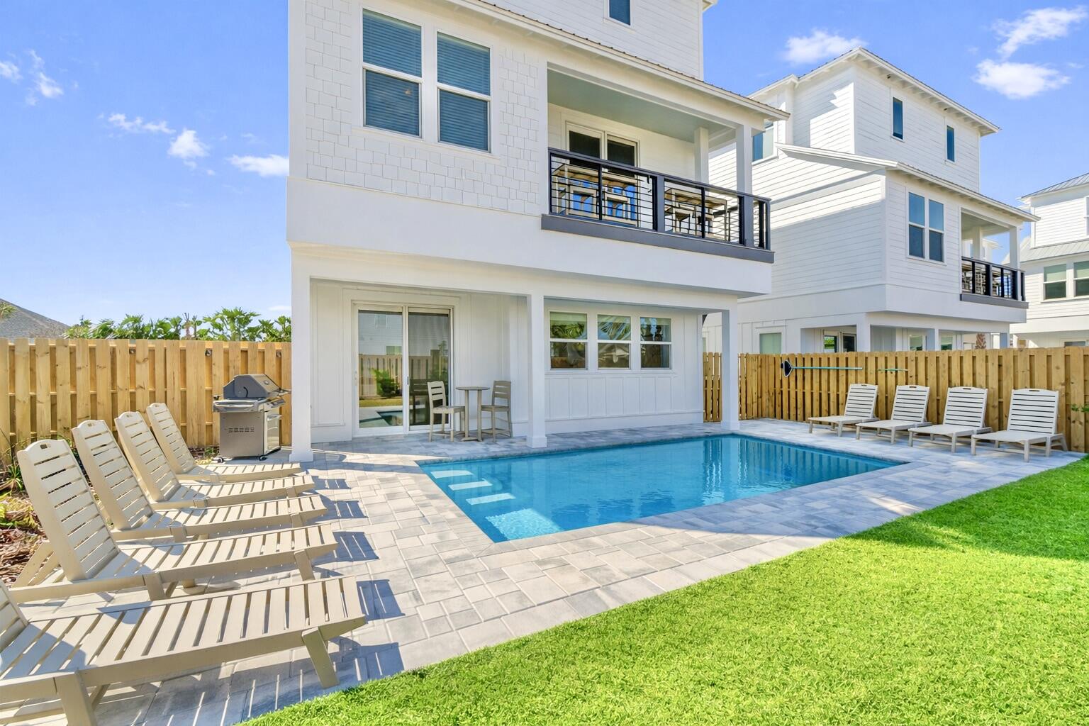 The current property management company is offering a $175,000 rental income guarantee for 2027, providing a compelling opportunity for investors seeking both immediate cash flow and downside protection. Welcome to 16 Blue Ohana Court in Miramar Beach, a fully furnished and turnkey 7-bedroom, 7.5-bath luxury vacation rental designed for strong short-term rental performance and immediate income generation. This spacious three-story home comfortably sleeps up to 22 guests and is being sold completely rental-ready, including a brand-new 6-seat street-legal golf cart, allowing for a seamless transition for any investor. The property already has over $130,000 in bookings secured for 2026 and is projected to finish the year at approximately $170,000 in rental income despite a delayed start in late February, with projected revenue for 2027 estimated between $190,000 and $210,000.

The home is purpose-built to maximize occupancy and revenue, featuring five king suites with private bathrooms and two high-capacity bunk rooms designed for large groups. The open-concept layout includes a chef's kitchen with a gas range, expansive living and dining areas, multiple lounge spaces, and a dedicated game room, all thoughtfully designed to enhance the guest experience. The private backyard offers a resort-style setting with a heated pool, covered outdoor living space, and ample room for entertaining, which are key drivers for repeat bookings and premium nightly rates. Multiple balconies and gathering areas throughout the home provide both privacy and functionality for large groups, and a community sand volleyball court is currently being constructed, adding another attractive amenity for guests and enhancing overall rental appeal.

Ideally located just about a one-minute golf cart ride to Miramar Beach's largest public beach access, the property offers easy access to the Gulf along with close proximity to Destin, Sandestin Resort, and Scenic Highway 30A. Guests benefit from nearby dining, shopping, and entertainment, further supporting consistent rental demand year-round. This property stands out as a high-performing, income-producing asset with future bookings already in place, professional management available, and no additional setup required, making it an exceptional opportunity for investors seeking a proven luxury vacation rental in one of the Emerald Coast's most desirable markets.