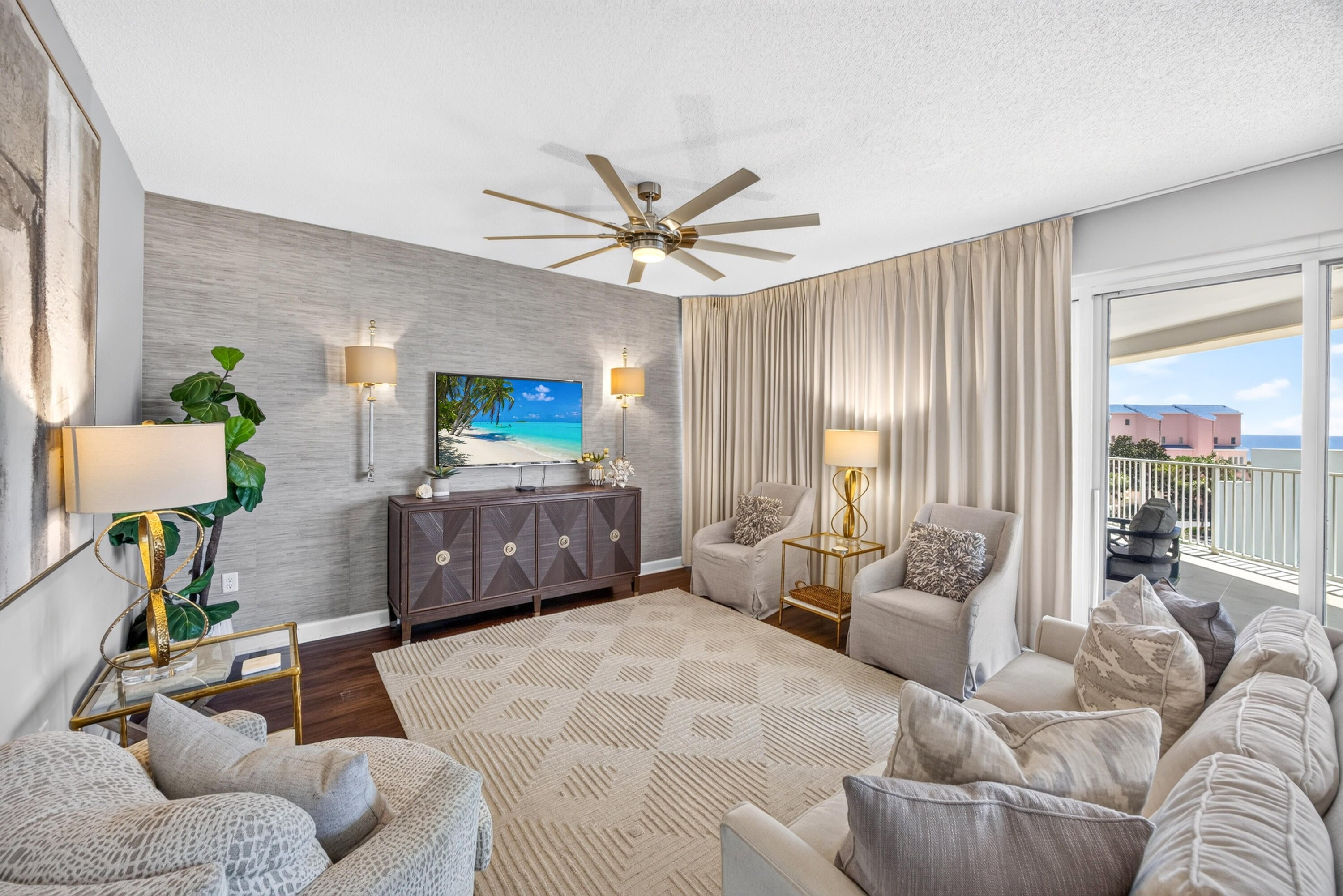Discover coastal elegance in this beautifully remodeled beach condo located in the Tides at Tops'L, where warm wood-tone luxury vinyl plank flooring flows throughout, creating a welcoming and sophisticated atmosphere. The inviting living area is enhanced by a textured designer accent wall that adds warmth and character. The stunning kitchen features crisp white quartz countertops, stylish gold hardware, and stainless steel appliances for a timeless, upscale look. Both bathrooms have been thoughtfully renovated with spa-inspired finishes, offering a luxurious retreat after a day at the beach. Every detail has been carefully selected, making this move-in-ready condo the perfect blend of comfort, style, and coastal living. This southwest-facing, handicap-friendly condo features an expansive 20' x 39' covered balcony, perfect for soaking in the Gulf views. Tides Owners and Guests will enjoy an exclusive Gulf front pool, tennis courts, pickleball, shuffleboard, grilling area, poolside bar and grill, and the 600 feet of private beach frontage that TOPS'L has to offer. In addition, TOPS'L Owners also have the option to join an award winning tennis and fitness facility with 12 lighted courts, fitness center with exercise classes, saunas, locker rooms and two Club pools.