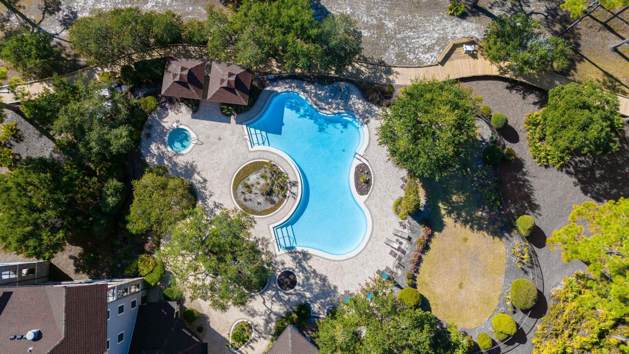 Exceptional 0.26-acre homesite in the prestigious gated community of Wild Heron! Located at 1522 Sweetbay Trail, this spacious lot offers privacy, mature pines, and a peaceful natural setting, perfect for building your custom coastal retreat. Enjoy resort style amenities including a lakeside pool, hot tub, fitness center, fire pit, pavilion, grills, playground, walking and biking trails, and the Boathouse with kayak and canoe access to Lake Powell, Florida's largest coastal dune lake. Wild Heron is also home to the Greg Norman designed Shark's Tooth Golf Club. Conveniently located minutes from the Gulf's white sand beaches, 30A, Pier Park, dining, shopping, and Northwest Florida Beaches International Airport. Build your dream home and enjoy the exceptional lifestyle Wild Heron has to offer!