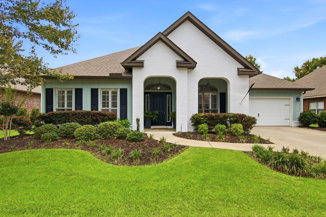 Peaceful lake views immediately set the tone for this beautifully designed home -- creating a sense of calm that carries throughout the entire space. Ideally located just minutes from the sugar-white sands of Blue Mountain Beach and the public beach access at Gulf Place, this home offers the perfect blend of coastal convenience and quiet retreat. The home has been thoughtfully updated with fresh white-painted brick on all four sides, accented by a charming brick water table and Hardie Board & Batten details in soft, coastal-inspired tones.
Inside, the spacious layout was designed with both everyday living and entertaining in mind. Featuring 5 bedrooms and 3 bathrooms thoughtfully arranged across 3 private suite areas, the home offers flexibility and comfort for family and guests alike. Just off the foyer, a dedicated office provides the perfect spot for working from home, relaxing with a book, or creating a cozy media room. Additionally, the formal dining room adds elegance and character for intimate gathering with friends and family. At the heart of the home, the expansive kitchen opens seamlessly into the great room and is truly made for entertaining -- complete with a peninsula island as well as an oversized center island; multiple prep areas, a massive walk-in pantry, soaring coffered ceilings with recessed lighting, and a lakefront dining area where everyday meals come with a view. New HVAC installed in 2023.