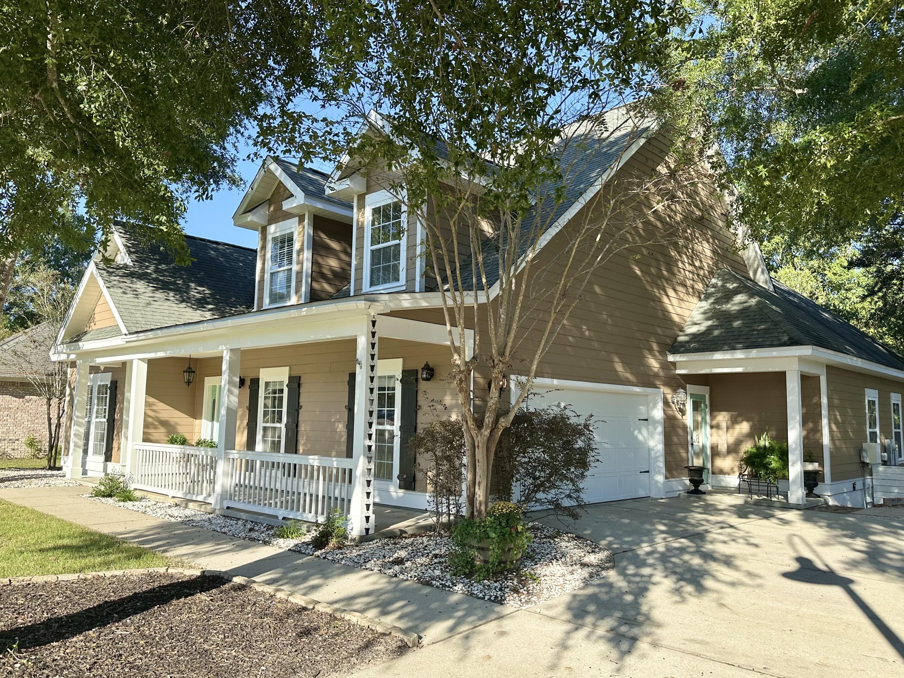 COMPETITIVELY PRICED! Imagine yourself living in a charming custom-built home in the Hammock Bay community, where resort-style amenities and a true neighborhood lifestyle exist. 

Step inside to a formal foyer and formal dining room, leading to an open living area filled with natural light and hardwood floors. The spacious great room opens to a covered patio and an expansive custom deck overlooking a serene preserve offering the perfect backdrop for relaxing or entertaining. The primary suite and two guest bedrooms are conveniently located on the main floor, while the second level features two guest bedrooms, a full bath, and a versatile bonus room ideal for an office or extra storage. Thoughtful upgrades throughout and quality finishes make this home truly stand out.

New wall oven and microwave 2025, freshly replaced/sealed deck, and recently painted inside and exterior painted within the last 3 years make this home is move-in ready.

Hammock Bay residents enjoy miles of walking trails, clubhouse, fitness center, sports courts, pools, a dog park, playgrounds, community events, and access to the Bay. Start your mornings with coffee on the spacious front porch and soak in the charm of this beautiful community. Homeowner is a licensed FL Real Estate Agent. Reach out for a private showing today!