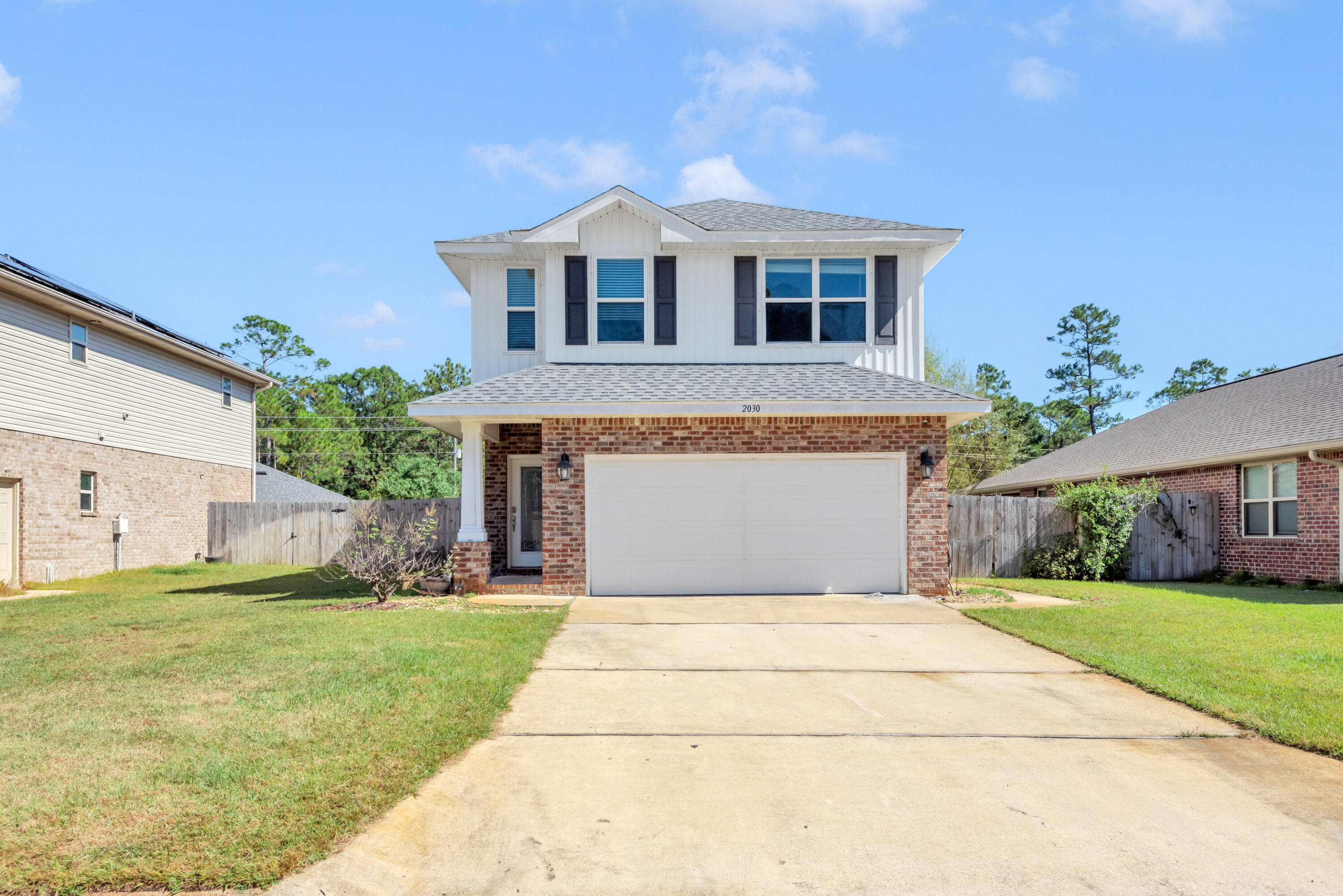 Sunset Pines is a well-kept community, located between Navarre and Gulf Breeze. This two-story home features 4 bedrooms and 2.5 bathrooms. As you enter the home the Great Room with high ceilings is straight ahead, windows throughout keep the room light and airy. The dining room is off to the side of the Great Room and also is very light. Adjoining is the kitchen, featuring a pantry, ample cabinets and plenty of counter space has all stainless appliances. This level also has a half bath. The upper level has all the bedrooms with the master suite to the back and 3 additional bedrooms to the front.  The master features a trey ceiling, and the master bath has a double sink vanity. The full laundry is also on the upper level. Downstairs the back door opens to an oversize patio with a pergola.