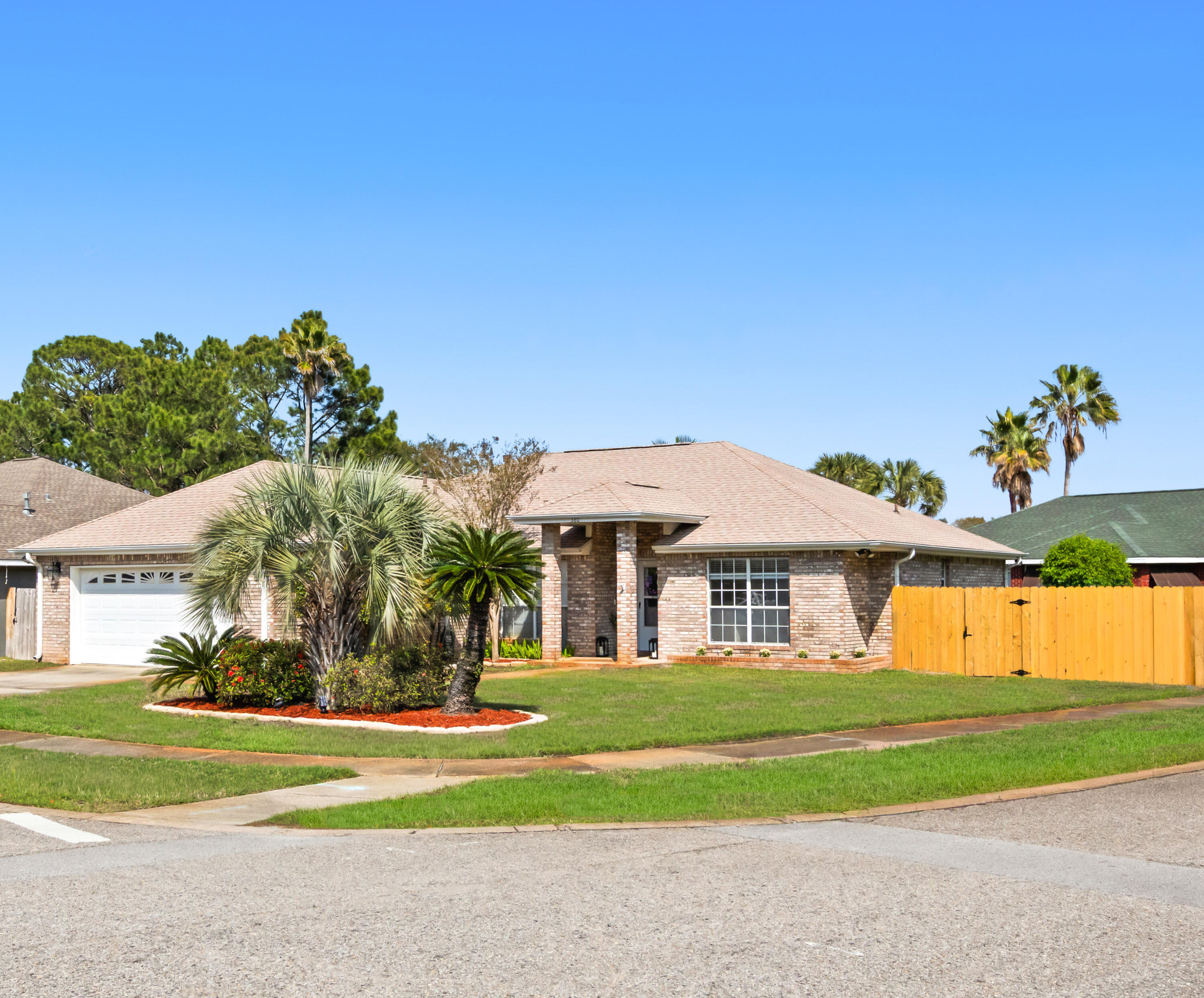 Located in the well-established Indian Woods neighborhood, known for its low turnover, this 3-bedroom, 2-bath brick home offers a practical layout and thoughtful updates throughout. The home is perfectly oriented for sunrise and sunset, enjoy the screened patio with no sun in your eyes. Situated on a corner lot with mature landscaping, the property provides both curb appeal and everyday functionality.  Inside, the split floor plan and open-concept living area create a comfortable flow for daily living. The main living space features high ceilings, durable LVP flooring, and a gas fireplace that adds a touch of warmth during NW Florida's winter months. The kitchen is designed with convenience in mind, offering an eat-in area, breakfast bar, and a separate dining space. Stainless steel appliances include a gas stove/oven, vent hood, refrigerator with ice maker, and dishwasher.  The primary bedroom includes high ceilings and an en-suite bath with double vanity, jetted tub, separate shower, walk-in closet, and private water closet.  Out back, a screened-in patio overlooks a yard with established fruit trees, an easy space to enjoy quiet mornings or unwind at the end of the day.  An added bonus is a heated and cooled storage space with a utility sink, offering flexibility for a variety of uses such as a workshop, hobby room, gardening station, or additional organized storage, an appealing feature for buyers who want functional space beyond the main living areas. Recent updates include modern lighting and ceiling fans, fresh interior paint, and renovated laundry room all completed in 2026, along with an updated sprinkler system in 2025.   Additional improvements include a complete fence replacement, improved gutters, a roof replaced in 2023 with double-membrane underlayment, and an HVAC system installed in 2021.  A solid option for buyers looking for a move-in ready home in a neighborhood where homes rarely come available. The location also offers easy access to Destin's white sand beaches, the emerald green waters of the Gulf of America, along with a variety of outdoor activities, restaurants, and family entertainment.

Schedule your private showing today!