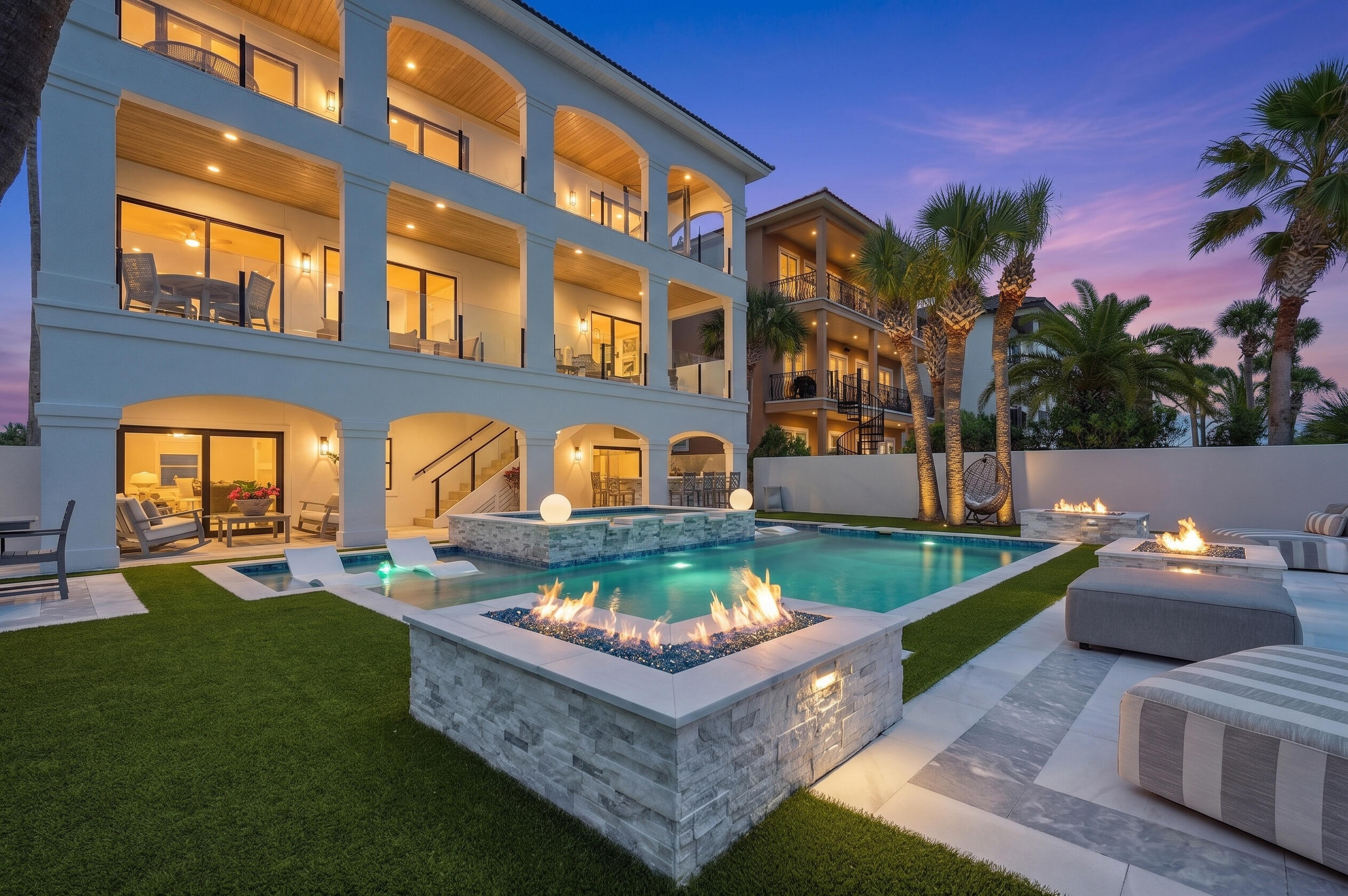 Rarely does an opportunity like this come along!

For the first time in years, tour the private bayfront residence of a renowned interior designer and experience a spectacular million-dollar transformation, meticulously crafted over the course of three years.

Her vision for luxury coastal living -- seamlessly connect elegant interior spaces with expansive outdoor living areas and resort-style amenities -- all framed by breathtaking views of Choctawhatchee Bay. Mission accomplished!

Welcome to 2580 Cayenne Lane in highly sought-after Casa Marina; an exclusive bayfront enclave with 18 homesites that is strategically positioned across from protected beach, and offers secure gated access for those who value privacy.

Built for coastal durability, this 3-story, 5 BR/4 Bathroom, ''Coastal Mediterranean'' features storm-resistant concrete and stucco construction, complemented by a newly painted exterior and a durable concrete tile roof.

There are 14 mature palm trees planted on site, along with expansive tumbled paver driveway (capable of parking 14 vehicles), and a sweeping staircase leading you to resort-style living with panoramic bay views. More on the resort-style pool and bayfront amenities... a little later.

Step inside to elevated ceilings with white-washed brick masonry accent wall, luxury moldings and trim, hand scraped wood floors inspired by coastal driftwood... and a wall of windows offering unparalleled views of the bay.

While the home offers 3 kitchens (continued) the second-floor primary kitchen boasts white cabinetry with soft-close features, luxury quartz with striking veining, subway tile backsplash, quartz island with built-in accent shelving, mini walk-in pantry with custom shelving, etched/frosted glass pantry door... and Fisher & Paykel appliances. There's also formal dining space with designer accent lighting.

The wall of windows flood the spacious living room with light and play host to newly installed motorized shades. Sliders lead to a 2nd story balcony that spans the entire width of the home and includes slip-rated porcelain tile flooring and frameless glass safety railing curated to complement (never detract) from the waterfront vista. 

The designer also added white-washed Floridian pine tongue and groove ceiling (above each balcony) and redesigned the outdoor staircase leading to each floor.

There is a guest bedroom on the second floor with a coastal-inspired color palette, crown molding, spacious closets, wood floors, bay views and a neighboring travertine bathroom that includes Italian-inspired custom walk-in shower with glass enclosure and granite bench seating.

Your journey to the lower or upper level begins with a choice; ascend the elegant staircase or enjoy the convenience of a private elevator. Recently restored, the elevator has been intentionally left as a blank canvas, allowing you to personalize your view with custom wallpaper, artwork or bespoke mural... creating a one-of-a-kind experience on every ride.

The third floor is home to two luxurious master suites and a beautifully appointed guest bedroom. The primary master suite offers elevated sophistication and STUNNING VIEWS. The owner added a touch of whimsy with designer bubble lighting... her nod to the coastal waters and nautical vibe. She also added an owner's lounge area, built-in shoe gallery, walk-in closet with custom storage and serene ensuite.

The ensuite offers 360-degree views of the bay, whether standing in the frameless glass shower accented by dimensional tile inlay and window ledge seating, or relaxing in the sculptural freestanding slipper tub. 

The weathered gray custom cabinetry, includes soft-close features and incorporates a built-in styling station (appliance garage). The quartz vanity offers striking veining, with 2 sinks, and a linen tower. The newly designed water closet boasts dimensional tile walls and built-in laundry.

Enjoy private master access to the 3rd story balcony, which also spans the entire width of the home and was transformed by the owner/designer as described earlier for the 2nd story balcony transformation. 

The secondary master suite enjoys picturesque harbor views and features a spacious closet, concealed behind opaque privacy glass.

The secondary ensuite bath can be found here, and is truly one of the home's most captivating spaces; embracing a whimsical take on the Gulf. Here you'll find a custom tiled shower showcasing whimsical bubble-inspired detailing, complemented by designer lighting, and a frameless glass enclosure. A gulf-inspired color palette evokes the serenity of the coast while a stone bench provides a spa-like place to relax. A built-in smart panel allows you to control the temperature and water settings with the touch of a button.

There is an additional guest bedroom on the third floor, and just like every other room in this home... serene water views!

Elevator or Stairs? The choice is yours. Make your way to the ground floor and explore the studio-style apartment which includes living, dining and sleeping area with fireplace, a second fully-equipped kitchen and the 4th full bathroom.

The bathroom is well equipped with a custom wave tile walk-in shower with glass enclosure (more aquatic theming), and an integrated soaking tub. There's also a custom bar area highlighting the owners' love for travel.

Glass sliders lead to the ground level lanai which spans the entire width of the home and includes an outdoor kitchen (Kitchen #3). Designed for effortless entertaining, the outdoor kitchen offers quartzite counters, weather-resistant custom cabinetry, built-in gas grill, side burner, pop-up electrical tower and an outdoor television. A custom outdoor shower adds convenience and a resort-inspired touch after a day on the water.

The outdoor kitchen is connected to a drive-through garage, maximizing coastal airflow and providing convenience for storage, boating equipment, golf carts and outdoor gear.

The property's most impressive transformation is the backyard renovation. The owners expanded the usable yard 6 feet and reinforced the shoreline with a professionally engineered riprap seawall. They also installed an underground drainage system, complete with 4-inch drain lines from yard to bay. From there, they added a stucco privacy wall with aluminum gate and landscape lighting.

The dock was renovated with 14 new pilings, new lighting, a fish cleaning station with power and water, jet ski lift and an upgraded 10,000-pound boat lift, a must when you are less than 10 minutes from the pass and directly across from protected Air Force beach. Bonus:Manatees, Dolphins and the Regatta make a weekly appearance.

Finally, the owner designed a resort-style heated saltwater pool featuring PebbleTec finish with leathered marble coping, 3 waterfalls, 3 water shears, dual sun shelves, bench seating spanning the entire length, an oversized 20-person spa... all surrounded by low maintenance "infinity turf"... the perfect spot to watch the various nightly fireworks displays put on by Destin and Fort Walton Beach (Wednesday through Saturday).

Countless design upgrades and revisions transformed this home (too many to list) and the result is a one-of-a-kind waterfront coastal experience. Now, the owners invite the next stewards to embrace and enjoy this extraordinary lifestyle... but the clock is ticking. Better hurry!