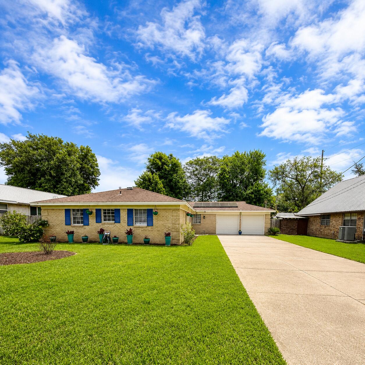 No HOA and low electric bill!! Solar panels paid off at closing Beautifully remodeled turnkey home featuring a brand-new HVAC system for total peace of mind. Step inside to discover gorgeous new LVP flooring and a custom built-in shelving unit perfect for décor and display space. The completely remodeled kitchen offers solid surface countertops, updated cabinetry, a new sink, and  refrigerator, while a large picturesque window above the sink fills the space with natural light and overlooks the lush, private backyard. Both bathrooms have been tastefully remodeled, and all four bedrooms offer comfortable space and versatility. Enjoy outdoor living on the new deck just off the breakfast nook, surrounded by mature landscaping for added privacy. Additional features include a spacious two-car garage, oversized driveway, and a backyard designed for relaxing or entertaining. Solar panels paid at closing offers a low electric bill.