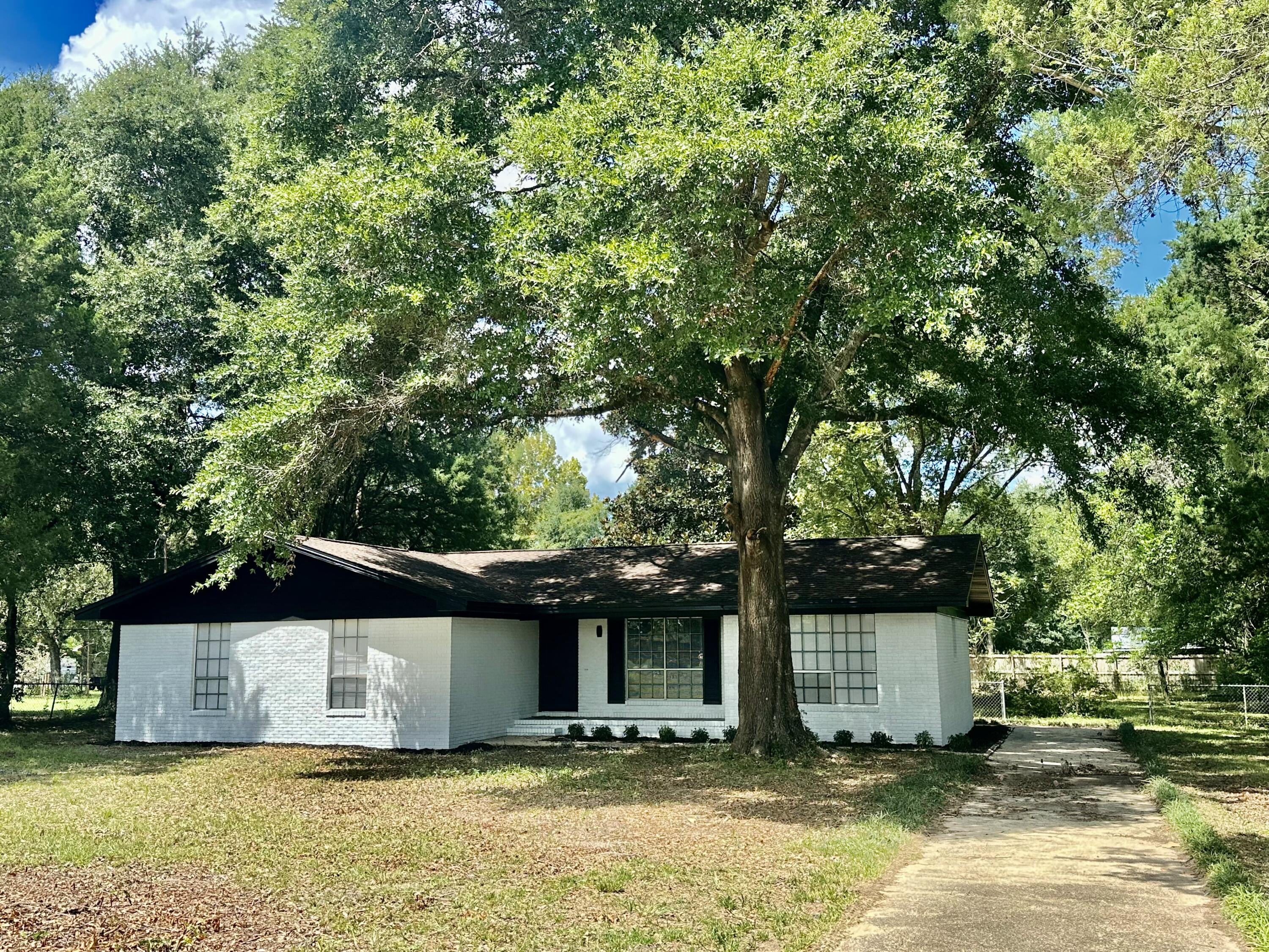 Renovated, move-in ready, and situated on a spacious half-acre lot! Welcome to 3025 Stillwell Blvd, a beautifully refreshed 3-bedroom, 2-bath home offering 1,648 +/-  square feet of living space with a huge bonus room that provides endless possibilities.Originally built in 1976, this home has been extensively renovated from top to bottom, creating a fresh, modern feel while maintaining the charm of an established property. The interior features a clean black-and-white design throughout, complemented by warm stained butcher block countertops in the kitchen. Updates include new interior paint, new flooring, new butcher block countertops, a new kitchen sink, and extensive renovations throughout the home.The spacious primary bedroom features a walk-in closet, while the additional bedrooms offer plenty of room for family, guests, or a home office. The oversized bonus room is one of the home's most versatile features and could easily serve as a fourth bedroom, media room, game room, home office, playroom, or additional living space.
Outside, the 0.5-acre lot provides plenty of room to enjoy the outdoors, entertain, garden, create a play area, or simply enjoy the extra space that is increasingly hard to find. Some photos are digitally staged