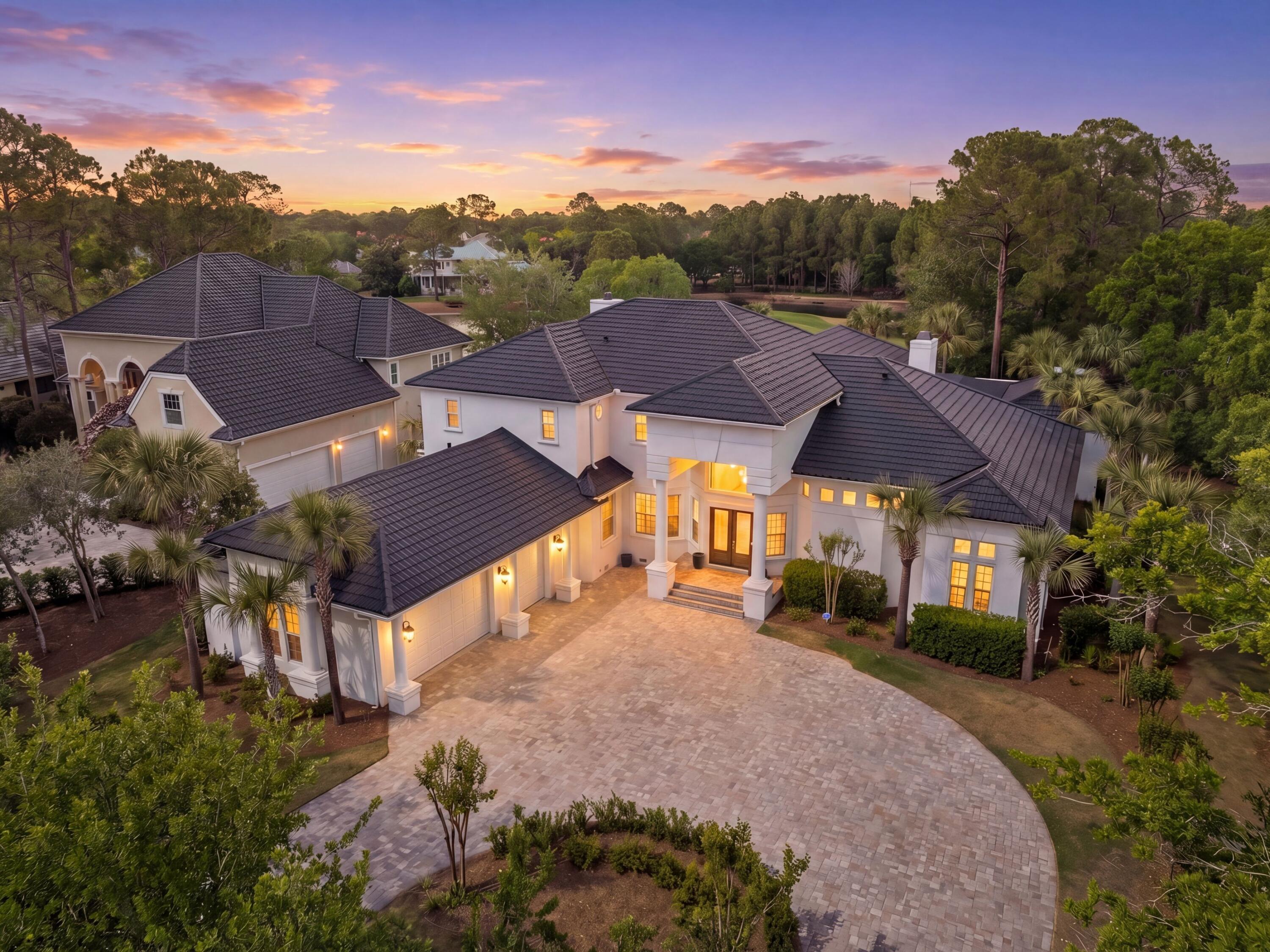 Thoughtfully reimagined and ideally positioned within Sandestin's Island Green, this residence offers a refined, design-forward approach to living, where luxury, comfort, and wellness are seamlessly integrated.

Overlooking the Raven Golf Course, the setting is both private and picturesque, while the interiors reflect a cohesive and elevated design. With 5,391 square feet of renovated indoor living space, an oversized lanai and pool, and a generous fenced backyard featuring an elevated entertaining deck, all framed by enhanced landscaping and fencing overlooking the signature island green, this home offers both a relaxed sense of openness and peace of mind along the lakefront. The interior renovations have elevated the original home with improved kitchen cabinets and appliances, bathrooms, interior and exterior paint, wide-plank engineered hardwood throughout, curated lighting, and a reimagined 2nd-story floorplan allowing an additional bedroom. 

A defining element of the home is its comprehensive investment in wellness and environmental quality. From upgraded HVAC and new ductwork to whole-home dehumidification, advanced air and water filtration, and low-tox materials, every detail has been carefully considered to support a cleaner, more balanced living environment.

Outdoors, the re-plastered pool and spa have been thoughtfully upgraded to a heated saltwater system, complemented by luxury shell stone tile and an integrated sound system, creating a refined, resort-style setting designed for both relaxation and entertaining.

A collection of recent capital improvements, including a new metal roof (2025), impact-rated entry door, two new tankless water heaters, and a climate-controlled garage, enhance both long-term value and peace of mind.

An elevated retreat that not only presents beautifully, but lives exceptionally well within one of Sandestin's most sought-after golf course enclaves.