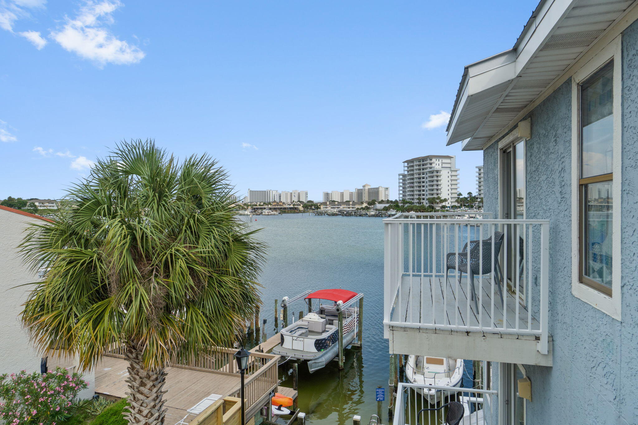 ENJOY DESTIN HARBOR FRONT LIVING where you can Rent a boat slip right outside your door for only $75/month!  The community's GATED/DEEDED beach access is only a short block away!!  You get it all with this FULLY FURNISHED TURNKEY super affordable condo!  Feel like you're almost sitting on top of the water as you enjoy the beautiful harbor views from your two balconies!  Take your own boat or the Destin Water Taxi to restaurants, dining and shopping  along the harbor with Crab Island only a dolphin's jump away!   Whether you choose to use as your primary residence or as a short term rental money making machine, this location can't be beat!   Two ensuite bedrooms provide the ultimate in privacy and the fully equipped and renovated kitchen has everything you need.  The converted garage is climate controlled and has tons of space for storage, dedicated areas to use for laundry, games, and a separate sleeping area with 2 sets of bunks featuring full beds on the bottom and twins on the top!  There's plenty of room for everyone!  With a dedicated parking space in addition to the converted garage, you can decide whether to park in or out.  If you're looking for a more intimate smaller community with 16 units total right on the harbor, this is it!!  Super close to all the activity when you want it and a quiet space to retreat to when you're ready to relax!  Call Today for an appointment to See!!