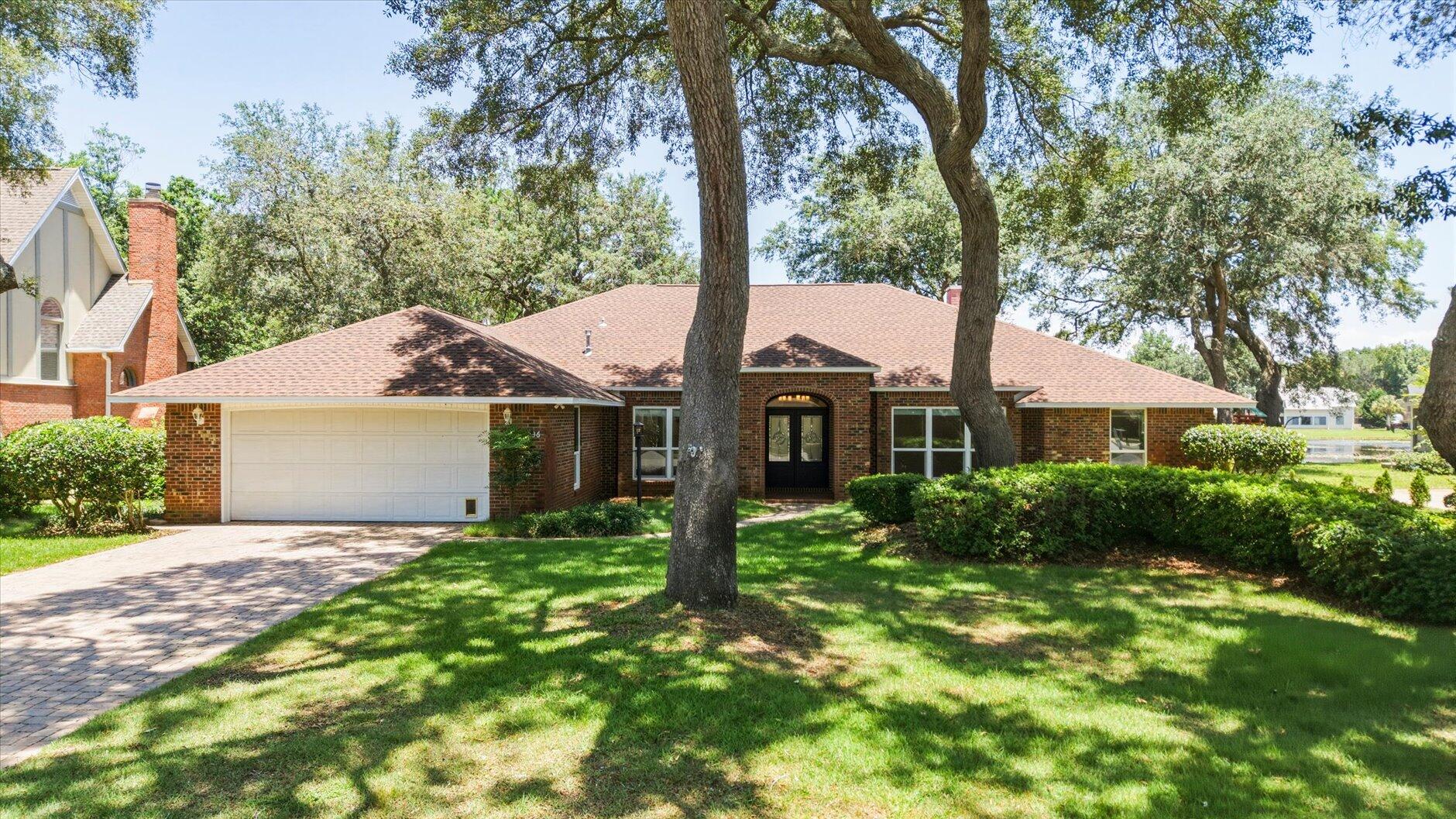 See the Virtual Tour! Absolutely stunning waterfront home in the highly desirable gated Windward community of Bluewater Bay! Situated on a premium lot with 100 feet of Lido Lake frontage, this beautiful 4-sided brick home offers breathtaking water views from a spacious open floorplan highlighted by a dramatic wall of windows.

Designed for both everyday living and entertaining, the home features a spectacular sunroom complete with a wet bar, wine fridge, ice maker, and additional TV area for game days. Step outside to the expansive deck overlooking the lake and enjoy Florida living at its finest.

This single-story, wheelchair-accessible home offers 4 bedrooms PLUS office, 3 full baths, an oversized 2-car garage, and gorgeous hardwood and tile flooring throughout--no carpet anywhere. Recent updates include a NEW ROOF, hurricane-impact windows, and newer kitchen appliances. Natural gas services the range, water heater, and outdoor grill connection.

Enjoy an unbeatable location just minutes from the Mid-Bay Bridge, providing quick access to Destin Commons, shopping, dining, and beaches while avoiding Highway 98 traffic.

Windward residents enjoy exceptional amenities including a gated entrance, tennis club, four swimming pools, pickleball courts, marina with waterfront restaurant and bar, golf course, and convenient boat and RV storage.

A rare opportunity to own a move-in-ready waterfront home in one of Niceville's most sought-after communities!