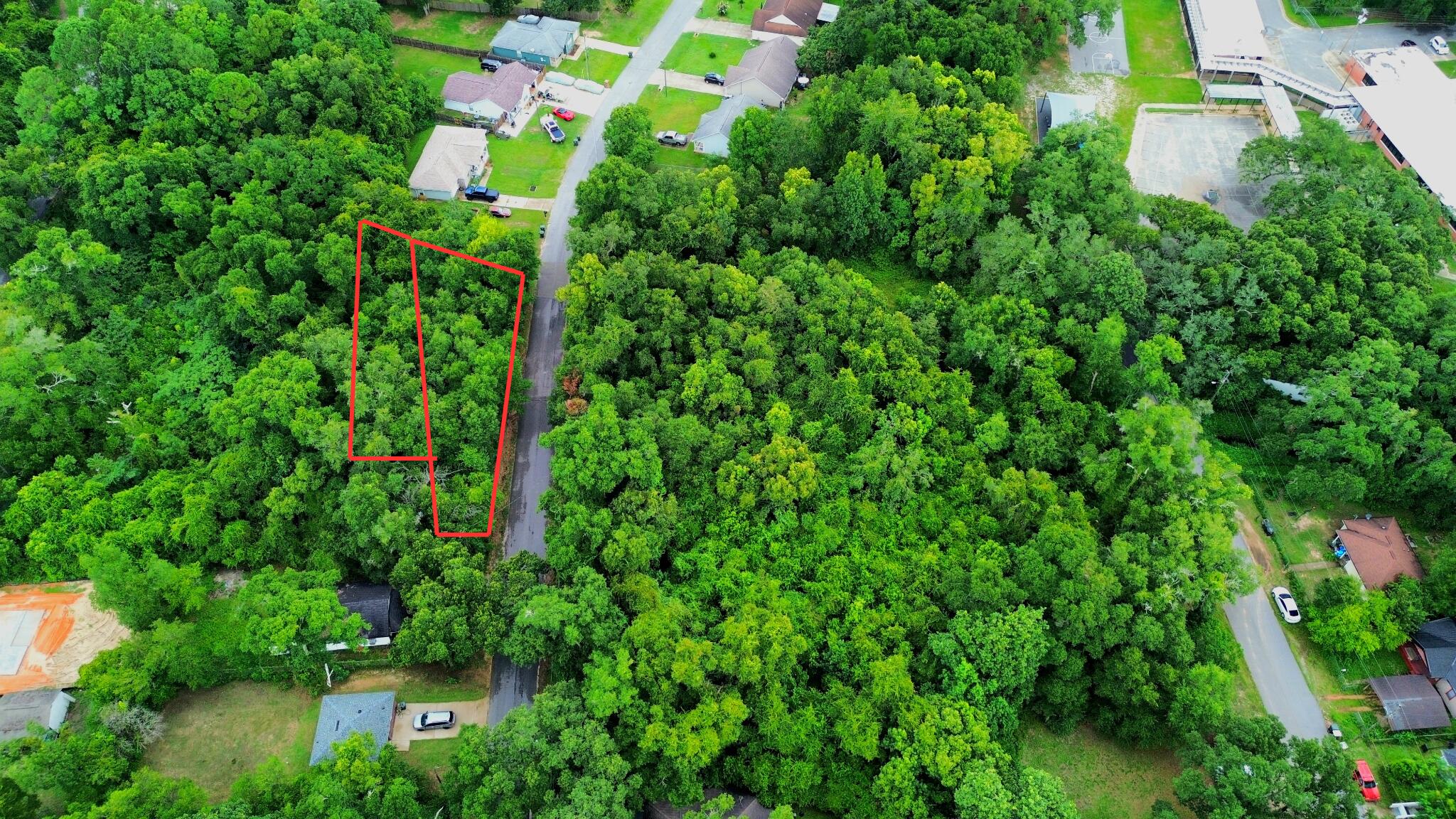 Two side-by-side parcels totaling 0.3416 acres presents an excellent opportunity just minutes from the front gate of NAS Pensacola! Situated just off Gulf Beach Highway on a partially developed residential street, the property offers convenient access to Perdido Key beaches, shopping, restaurants, and everyday amenities. Zoned MDR (Medium Density Residential), the lots provide flexibility for a range of residential development options. The property remains wooded, allowing you to preserve mature trees or clear the land to fit your vision. Tap fees have not been paid. Whether you're looking to build a primary residence, develop an investment property, or secure land in one of Pensacola's expanding areas, these adjoining parcels offer versatility and future potential.