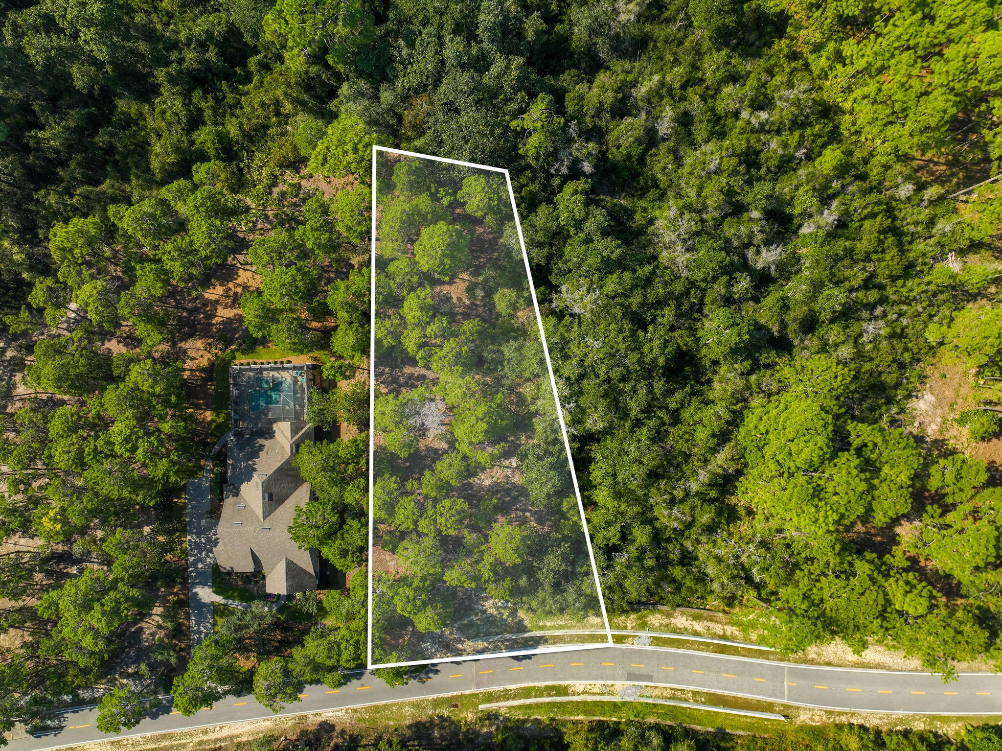 This .55-acre vacant lot is located in the gated Wild Heron community, offering access to beautiful natural surroundings and a variety of amenities. Residents enjoy access to Lake Powell, walking trails, an updated  fitness center, community pool + hot tub, and fire pit. Wild Heron is also home to the award-winning Watersound Club golf courses: Shark's Tooth and 'The Third', complimented by a newly renovated Clubhouse. (Golf & tennis are part of the Watersound Club membership).